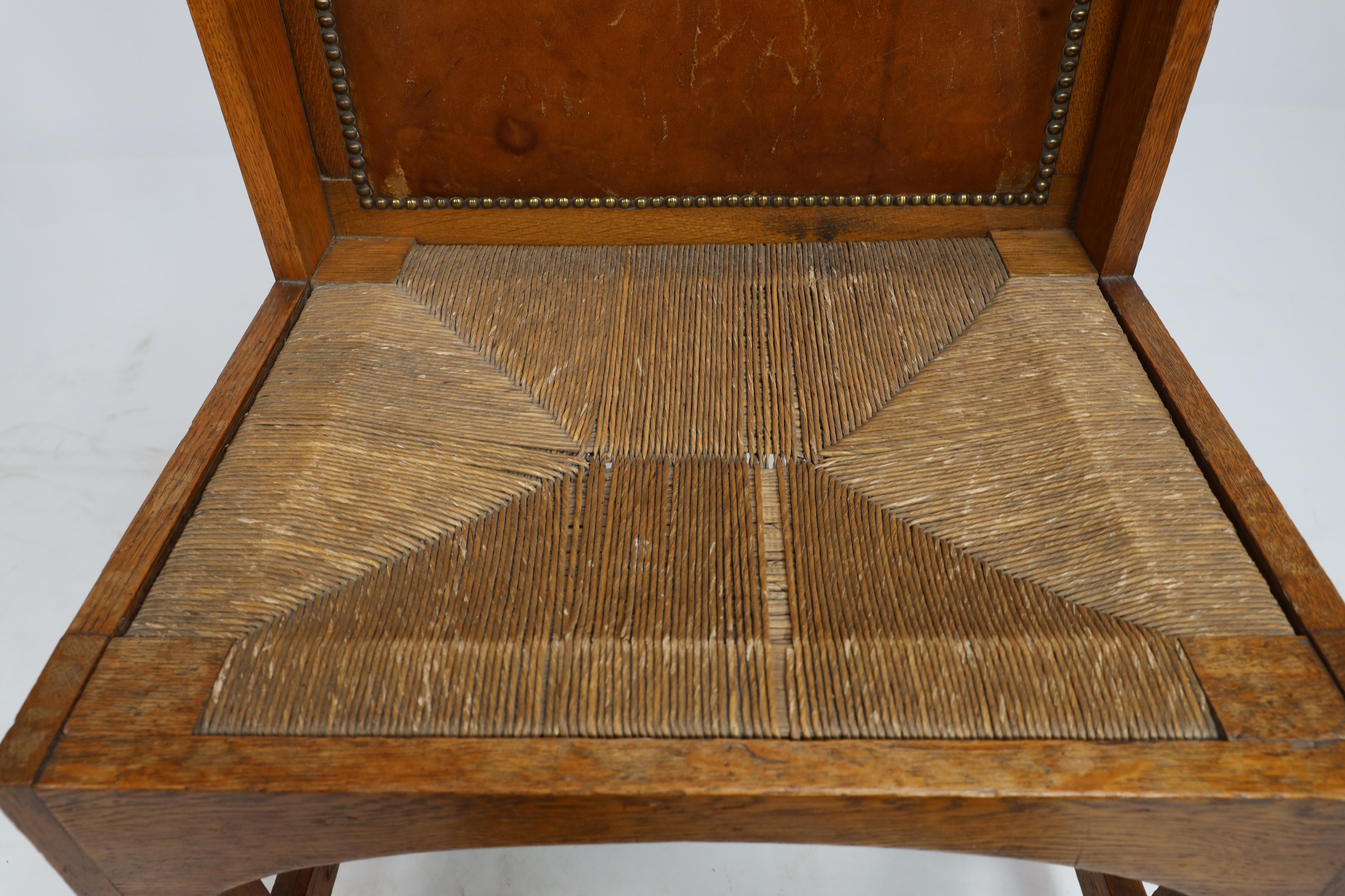 E G Punnet attributed. Probably made by William Birch. An oak wing back chair For Sale 2