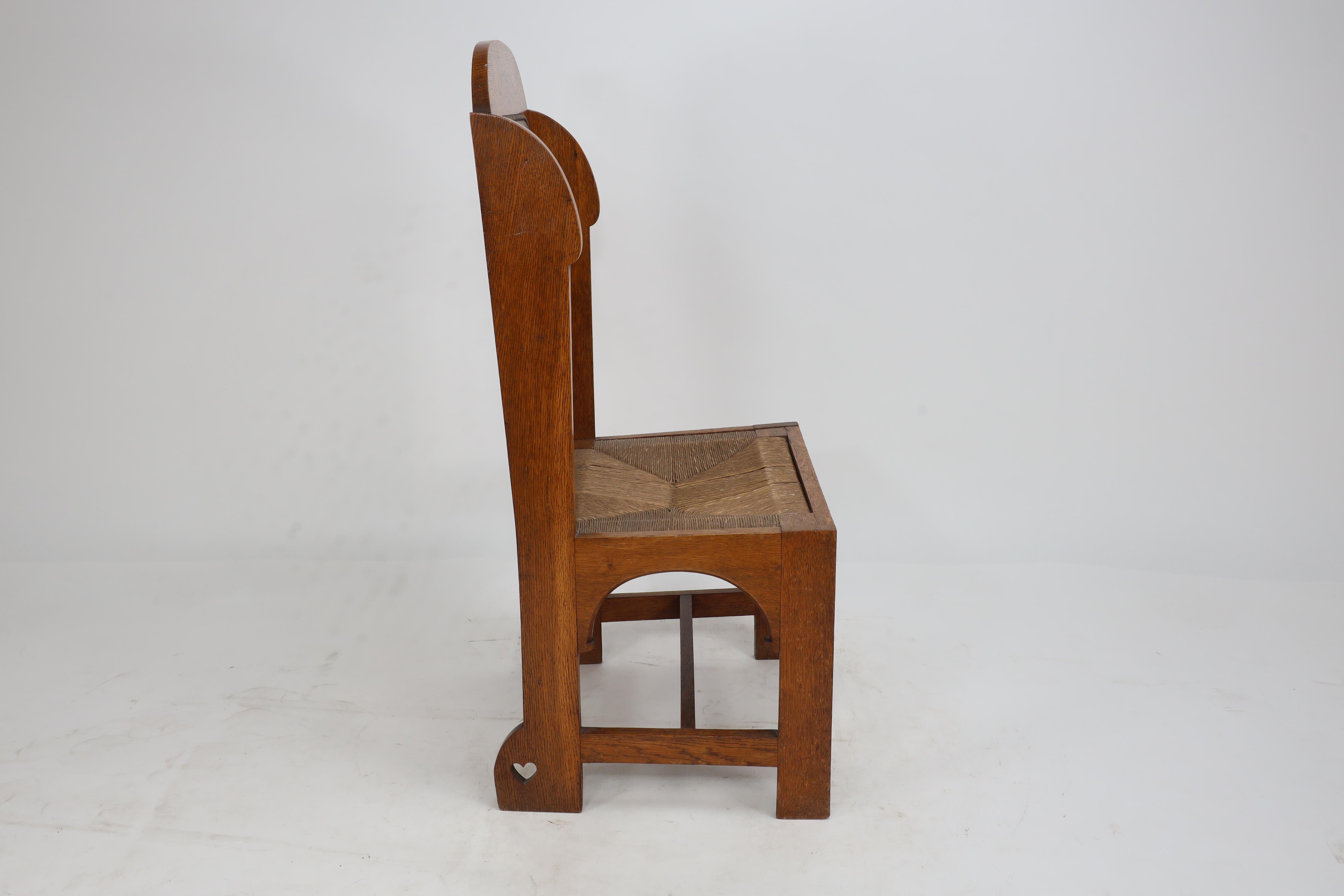 English E G Punnet attributed. Probably made by William Birch. An oak wing back chair For Sale