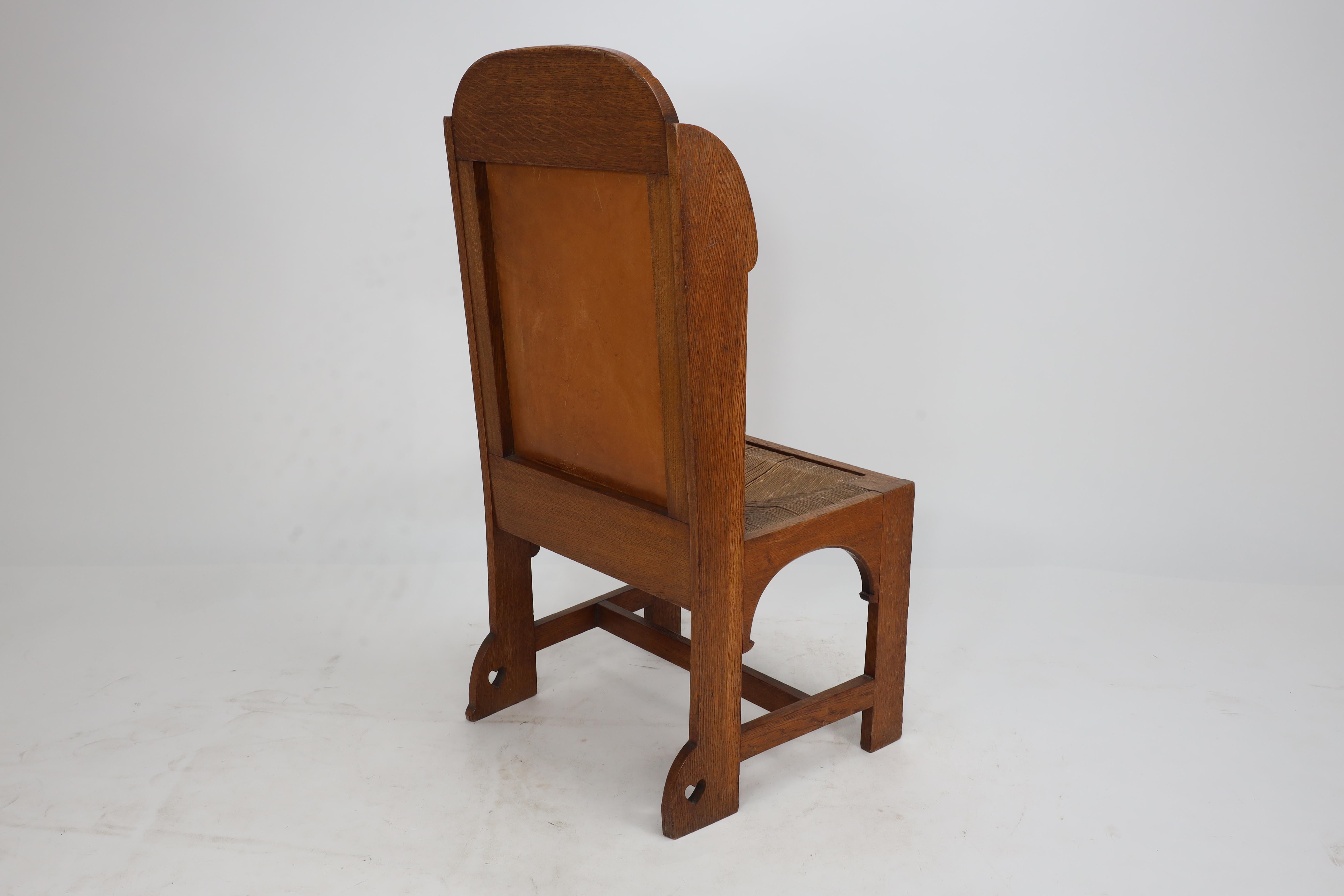 E G Punnet attributed. Probably made by William Birch. An oak wing back chair For Sale 10