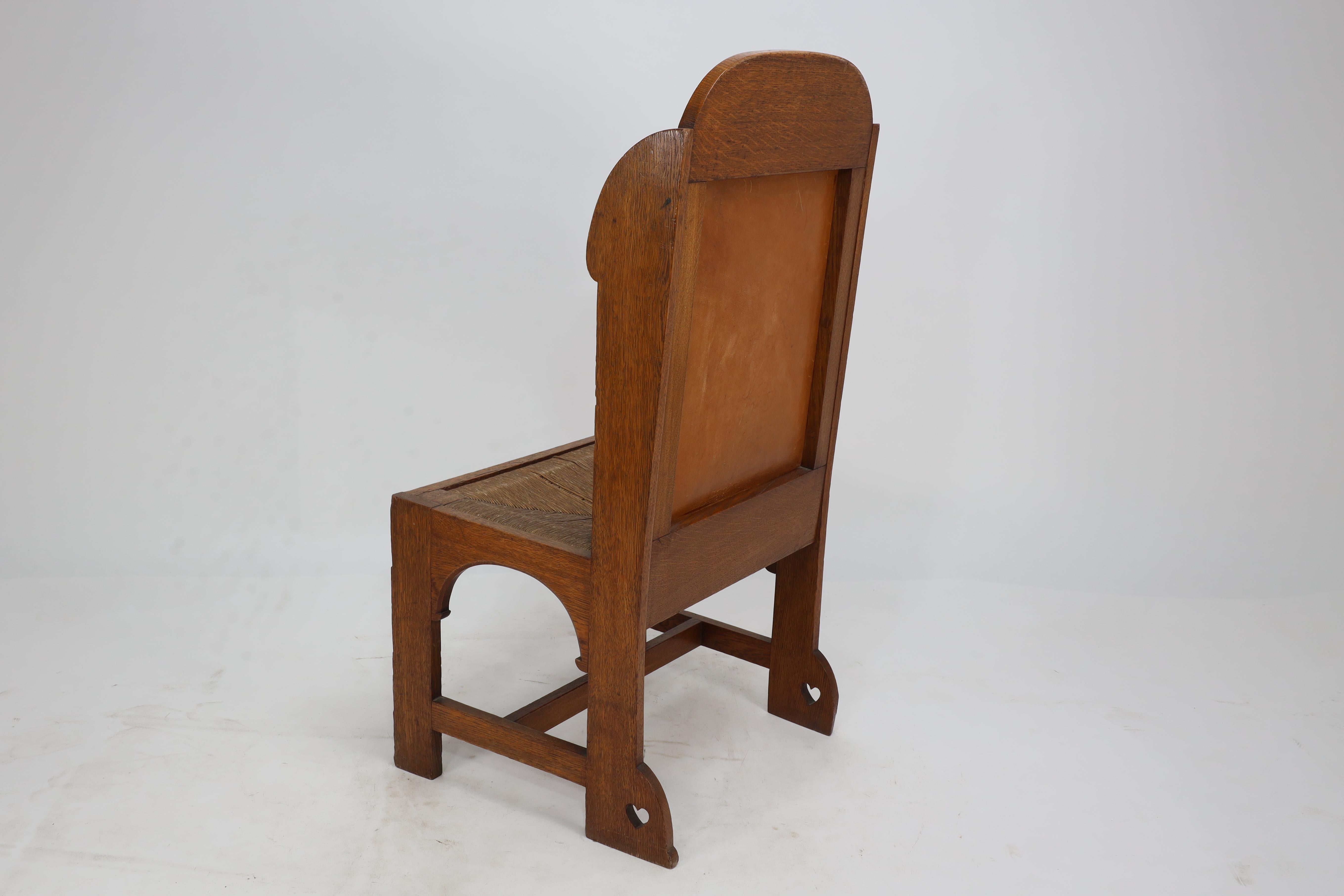 E G Punnet attributed. Probably made by William Birch. An oak wing back chair For Sale 12