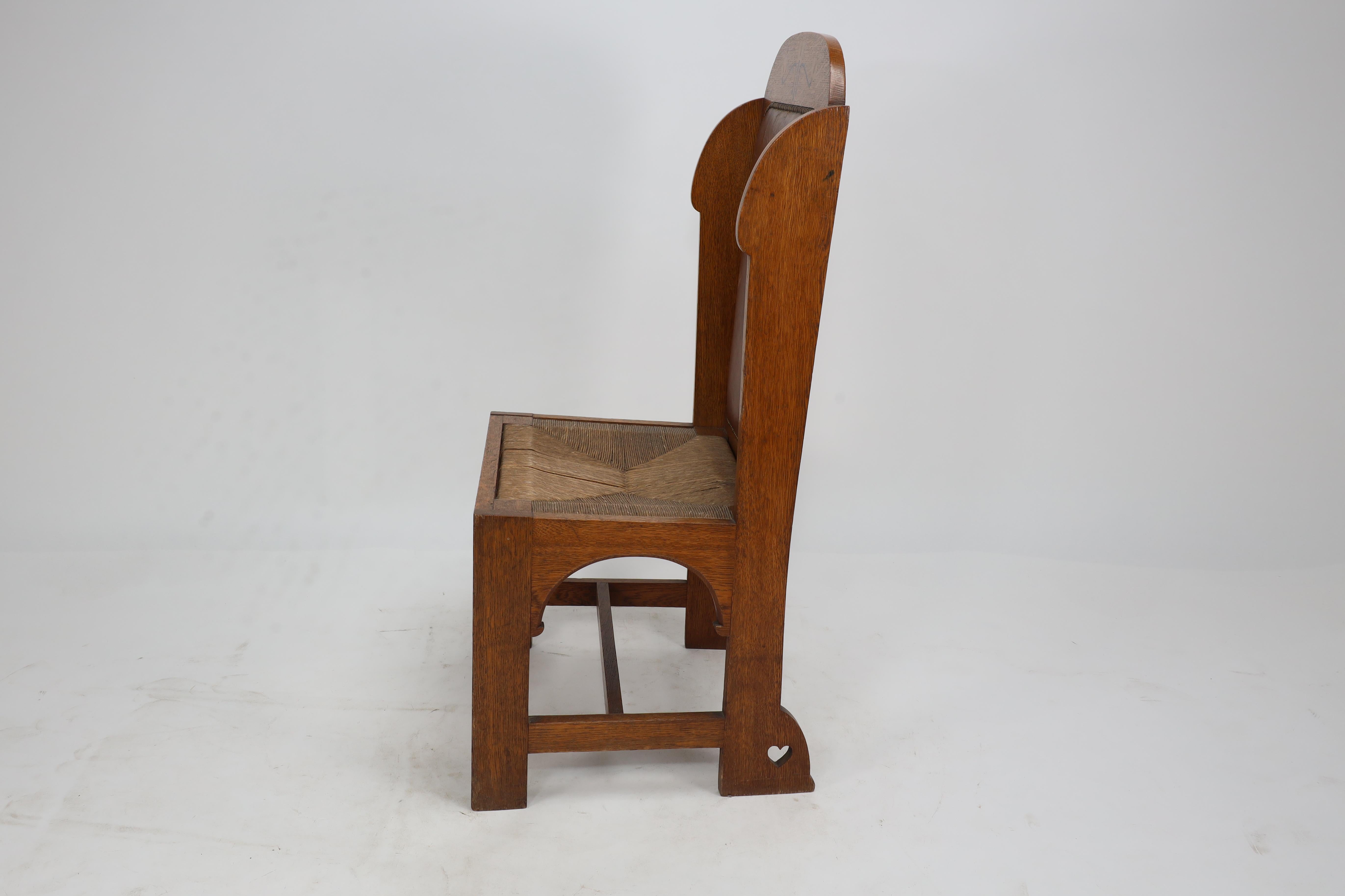 E G Punnet attributed. Probably made by William Birch. An oak wing back chair In Good Condition For Sale In London, GB