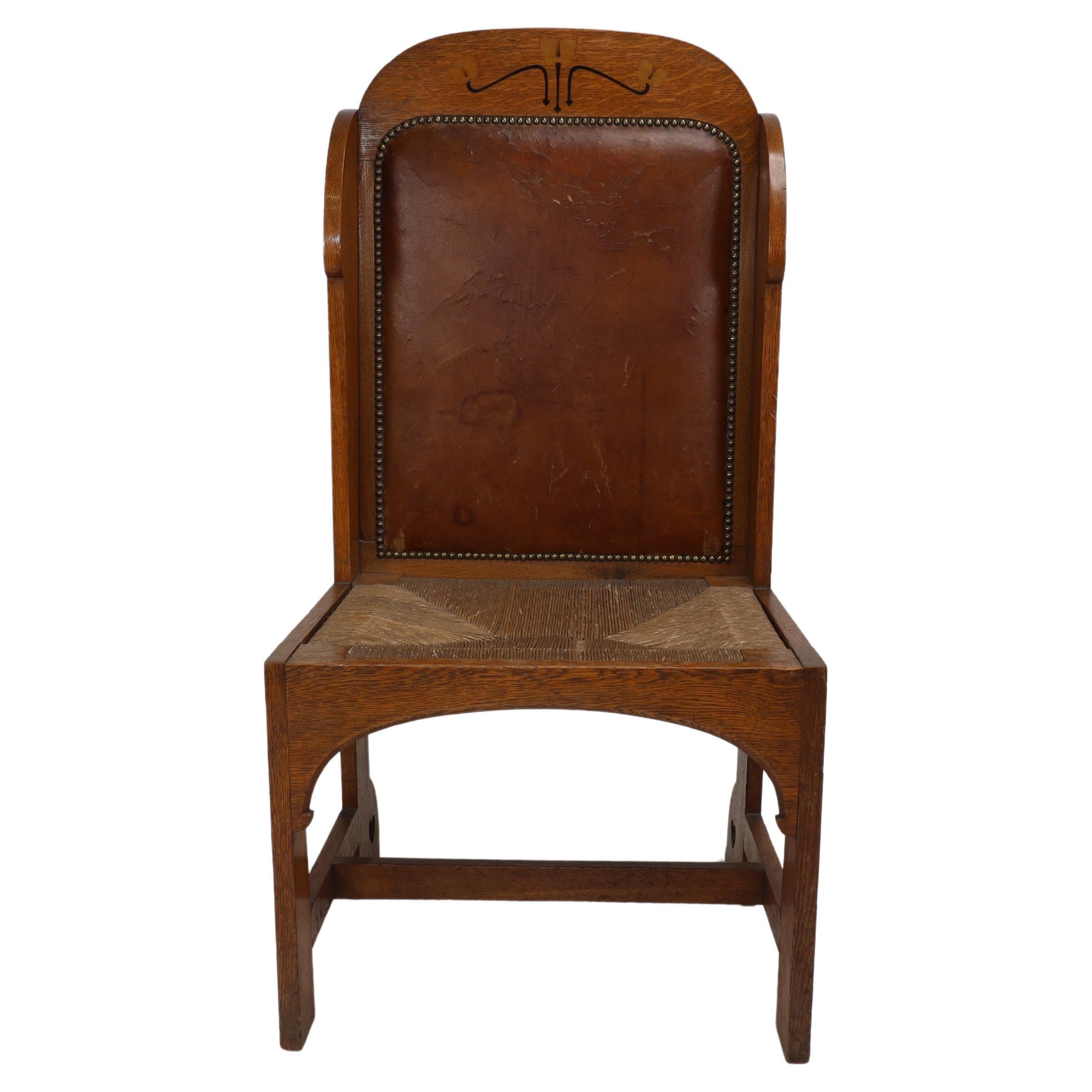E G Punnet attributed. Probably made by William Birch. An oak wing back chair For Sale