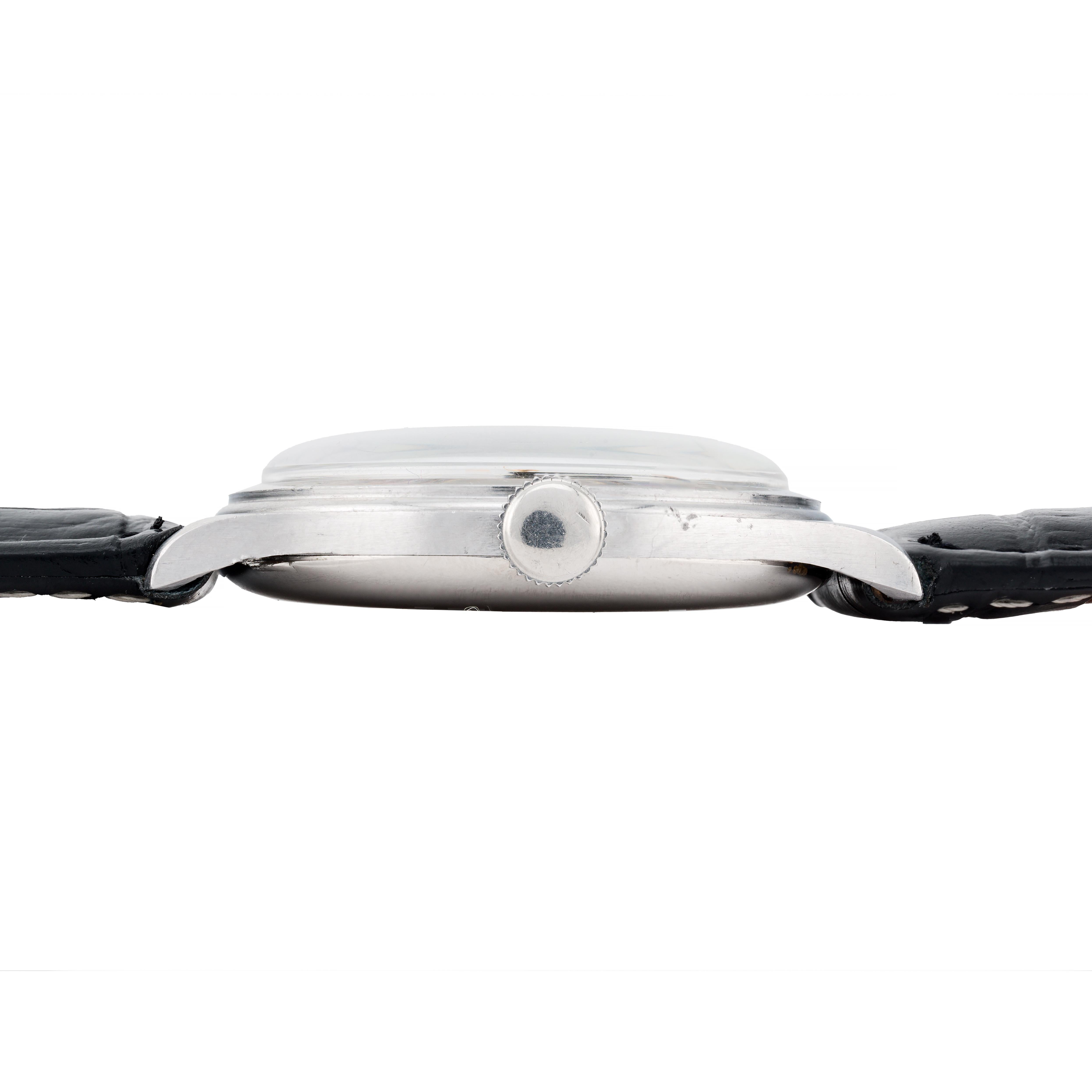 Aston Estate Jewelry Presents:

A refined E. Gubelin Lucerne wristwatch crafted in stainless steel with a classic black leather strap.

The round watch showcases a clean white dial with minimalist hour markers and the E. Gubelin  signature,