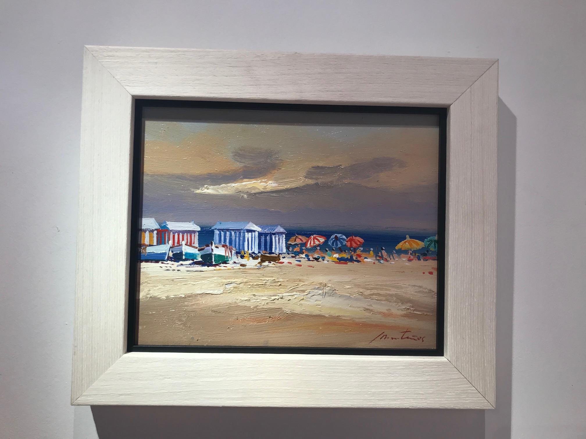 A warm and beautiful contemporary beach scene 'Beach Huts' by E. Martinez. This stunning seascape has a soft and natural colour palette, pale blues and earthy cool tones are subtle and mellow. Interesting textures create a warm and balanced