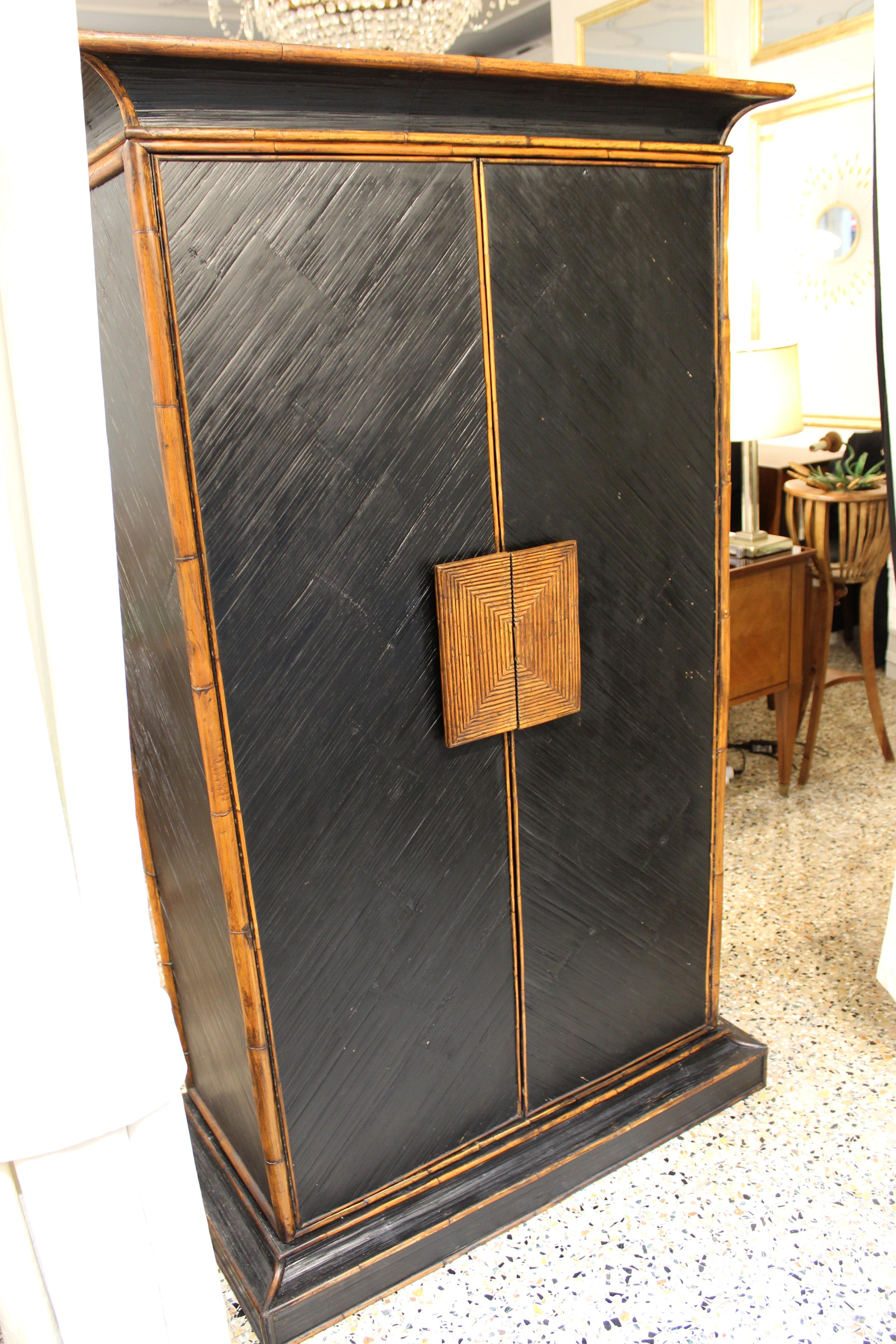 Original cabinet from E. Murio design, 1970s. Made in wood and bamboo, inside to be restored.

Size:
High 181cm
Width Borders 108cm, body 94cm
Depth Borders 52cm, body 44cm
Door 44.5cm/each.
 