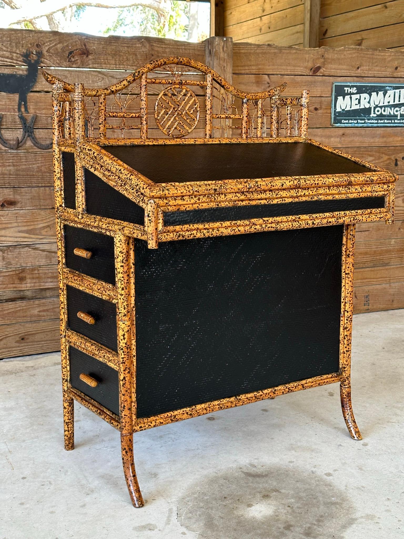 Introducing a fabulous E. Murio Manila Rattan Chippendale aesthetic movement slant front desk, which also makes a stunning entryway piece. This exquisite item has been meticulously refinished with high-quality oil-based paint, enhancing its elegance