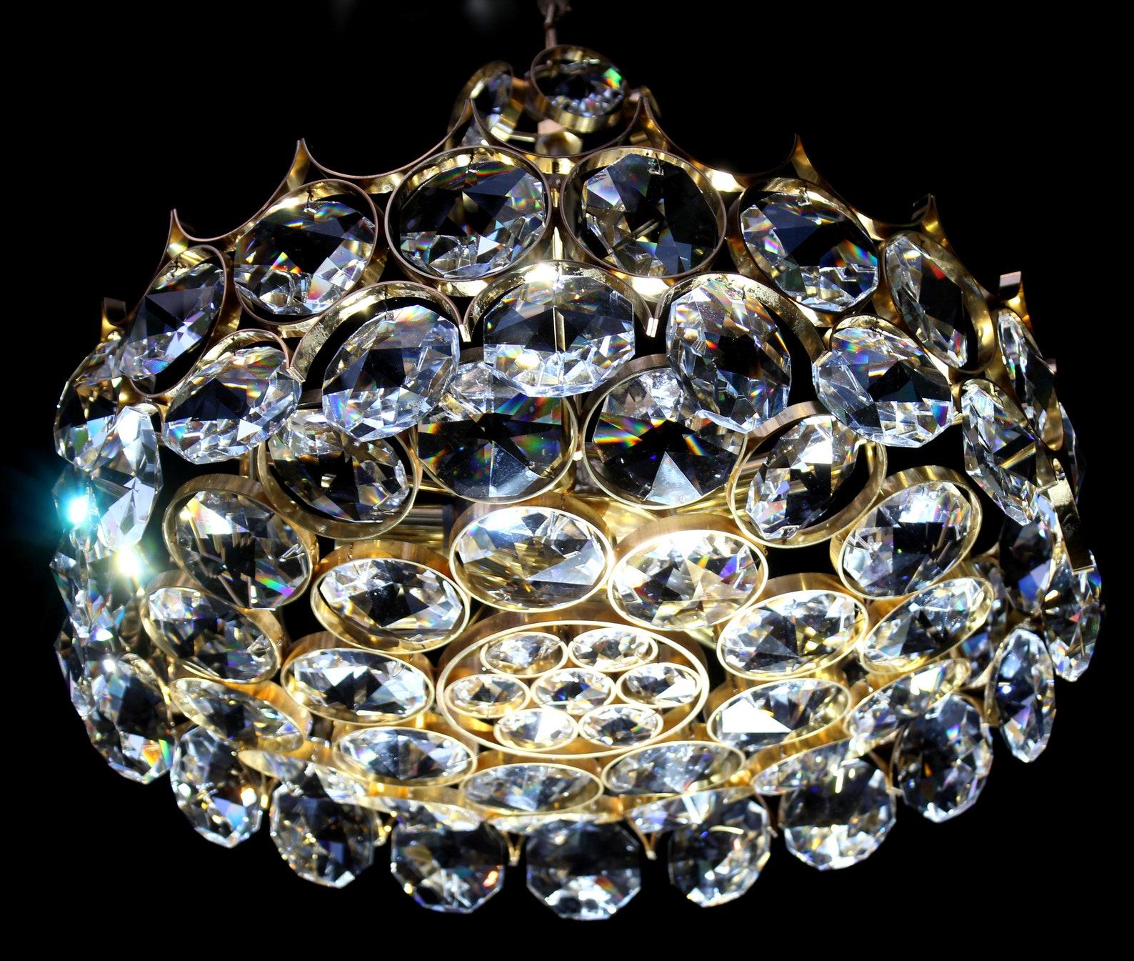 Ernst Palme gilt sputnik chandelier 1960`S 

Gilded brass with large Swarovski crystals

6 Lights , diameter 20 inches, original height 22 inches

The lighting manufacturer Ernst Palme had in the 50s to 60s some valuable design experiences