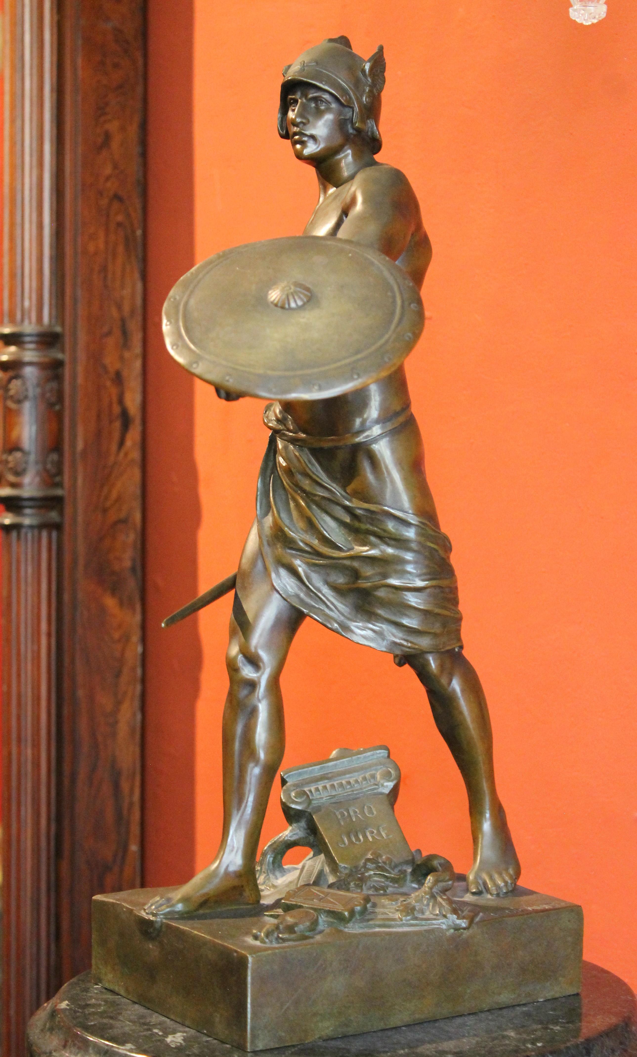 This extraordinary French burnished bronze figurative sculpture featuring a Gallic warrior victorious over the Roman legion was crafted in late 19th Century (1890 ca) by famed French sculptor E´mile-Louis Picault, one of the most celebrated
