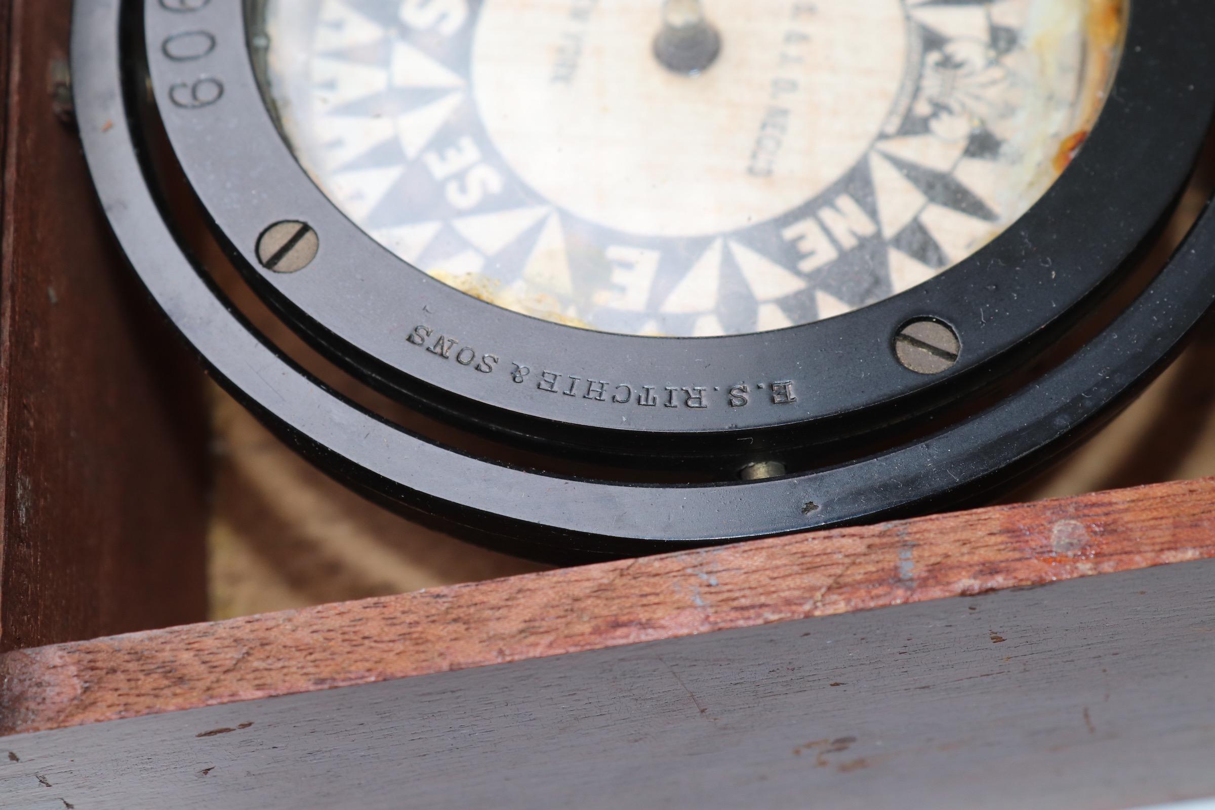 box containing a ships compass