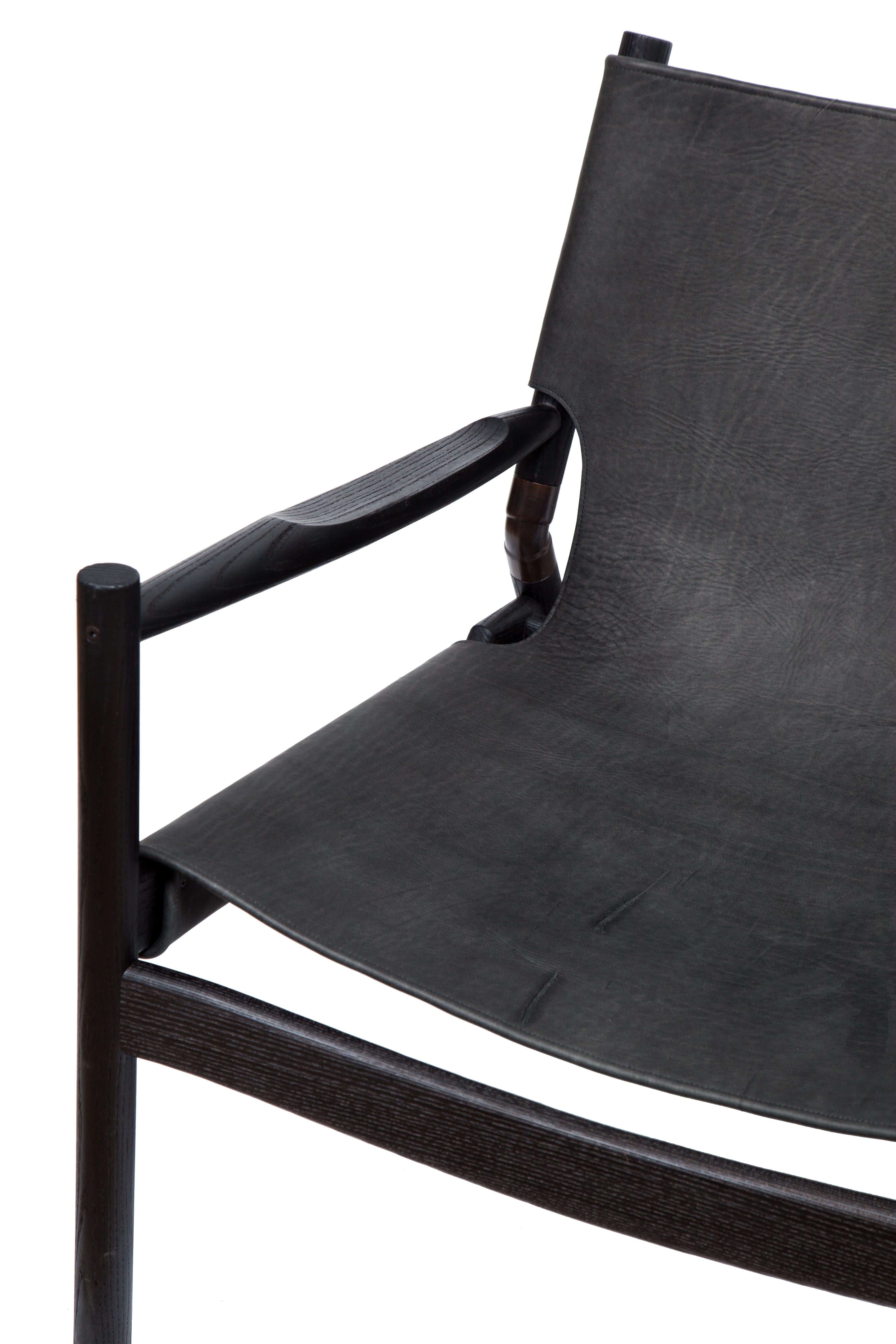 EÆ Slung leather lounge chair in Anthracite Horween nubuck leather with charred oak frame and blackened brass hardware by Erickson Aesthetics.