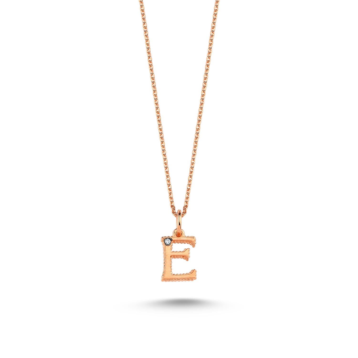 E small necklace in 14k rose gold with 0.01ct white diamond by Selda Jewellery

Additional Information:-
Collection: Letter collection
14K Rose gold
0.01ct White diamond
Pendant height 0.7cm
Chain length 44cm