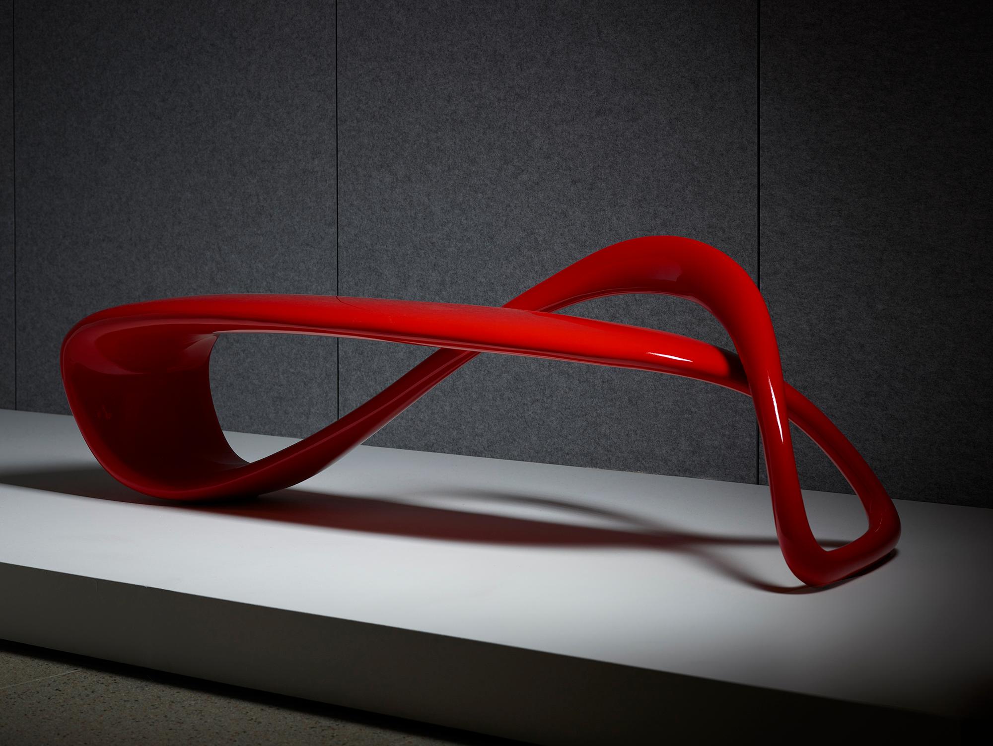 The result of exploring the possibilities of a singular line in 3D space, the E-Turn is a continuously morphing ribbon that twists and turns from seat to structure before overlapping and returning again in the configuration of a bench. The endless