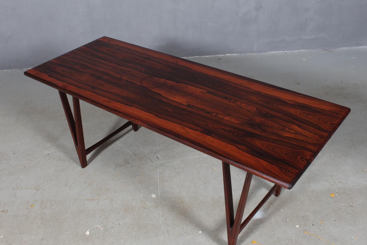 E. W. Bach coffee / sofa table with veenered rosewood plate.

V shaped legs.

Made by Møbelfabrikken Toften.