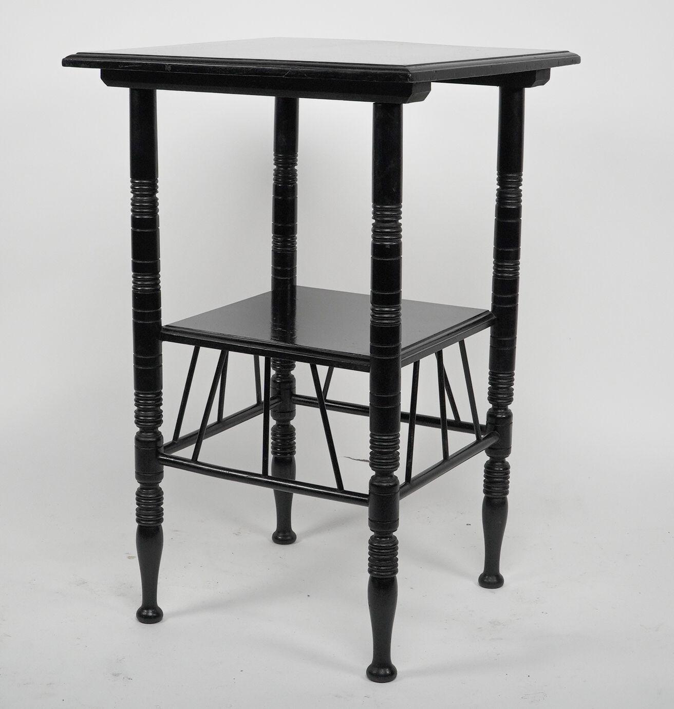 An Aesthetic Movement ebonized sidetable, after a design by Edward William Godwin (1833-86). Height 26 66cm, Depth 16 1/2 42cm.