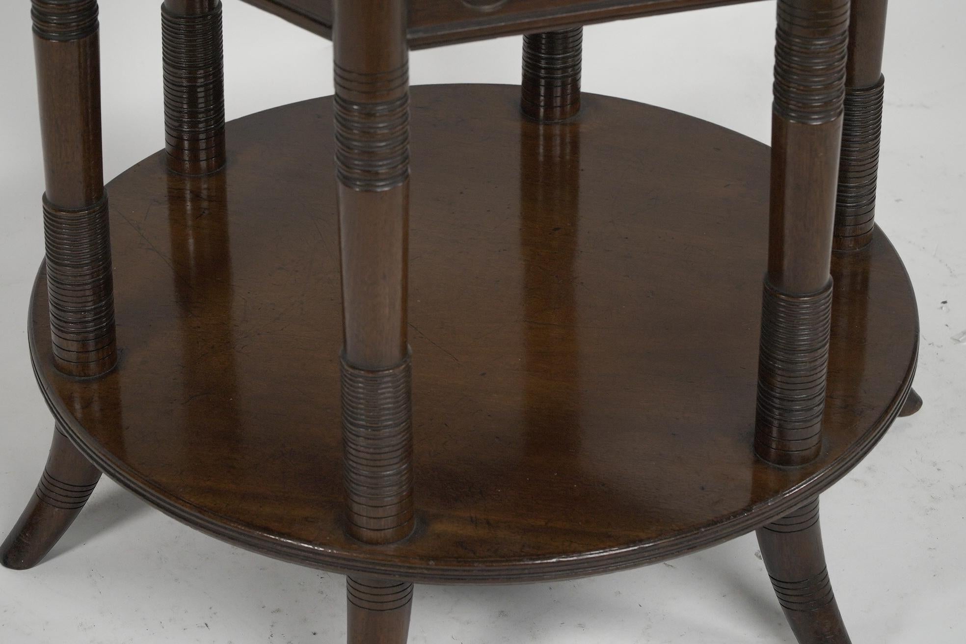 E W Godwin An Aesthetic Movement six leg walnut circular centre table For Sale 5