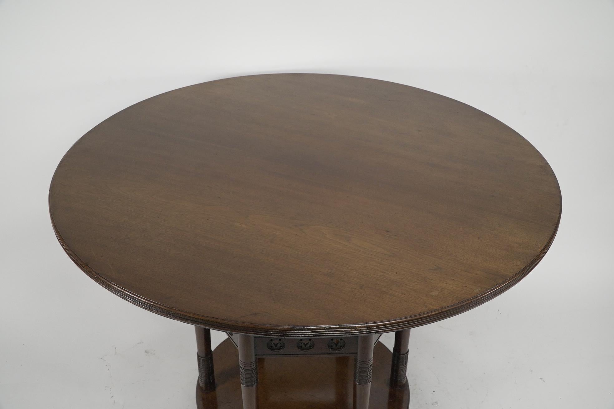 English E W Godwin An Aesthetic Movement six leg walnut circular centre table For Sale