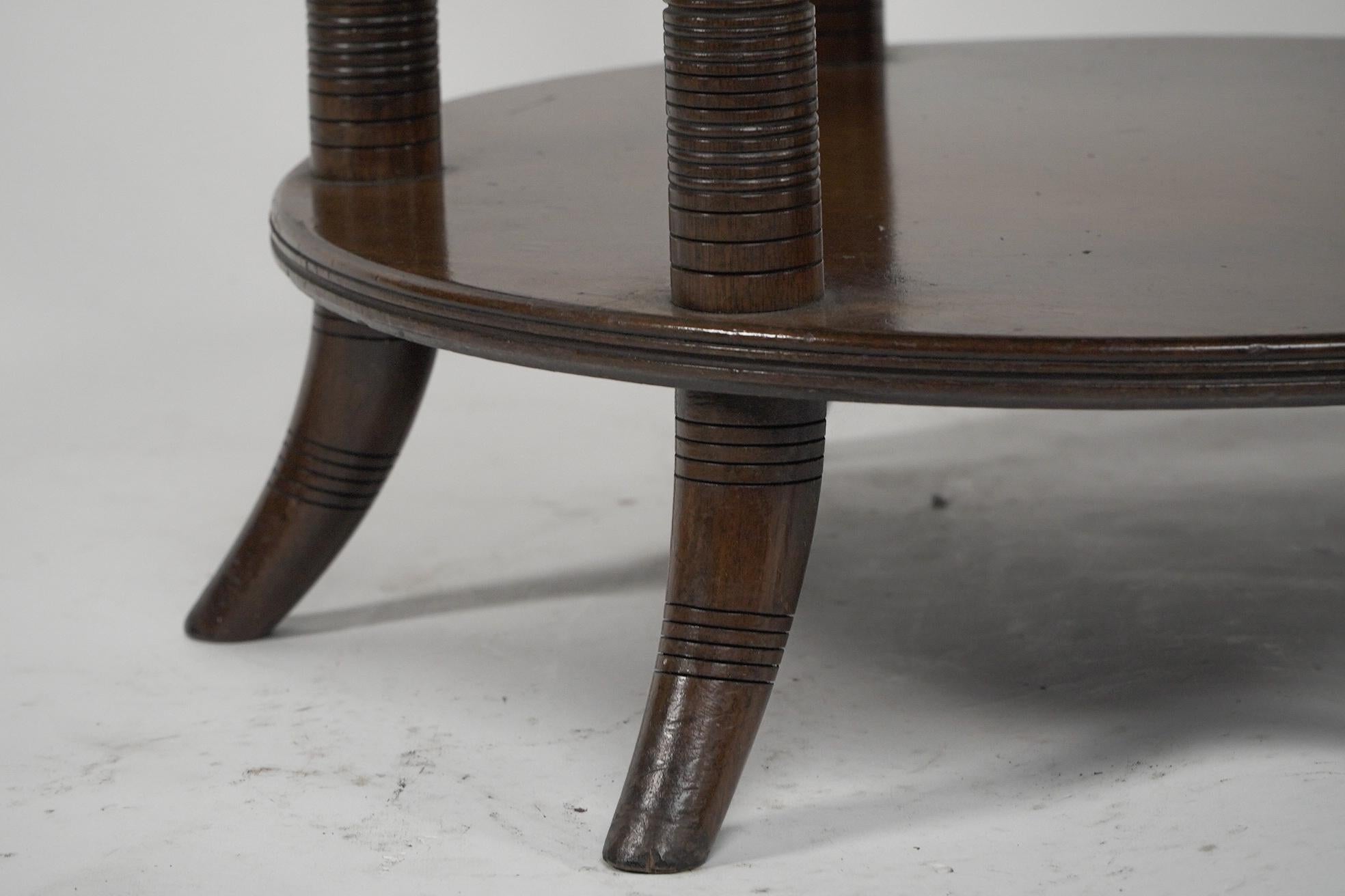 E W Godwin An Aesthetic Movement six leg walnut circular centre table For Sale 8