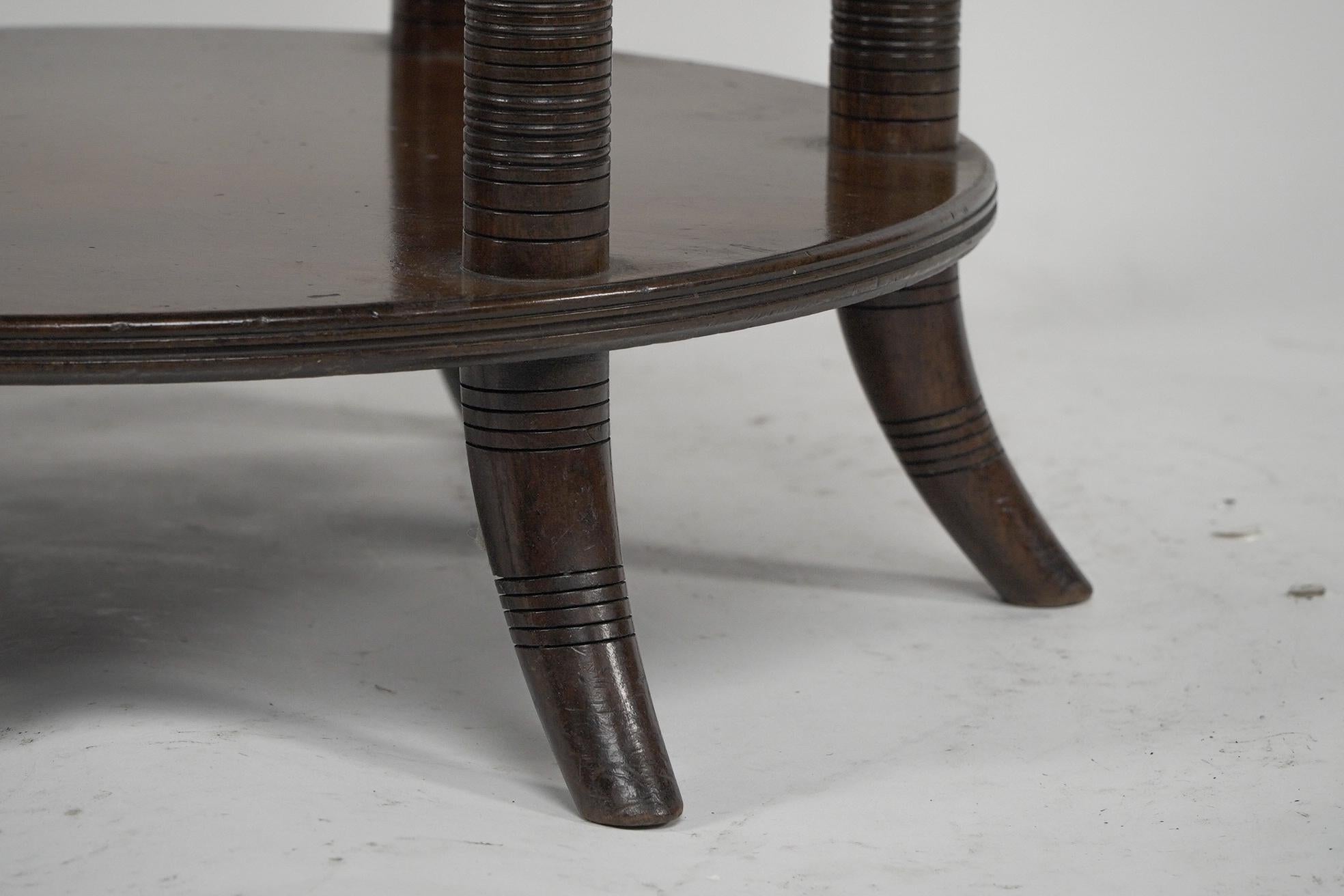 E W Godwin An Aesthetic Movement six leg walnut circular centre table For Sale 7