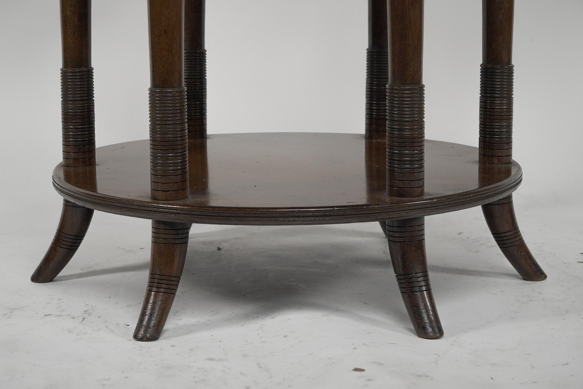 E W Godwin An Aesthetic Movement six leg walnut circular centre table For Sale 6