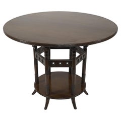 Antique E W Godwin An Aesthetic Movement six leg walnut circular centre table