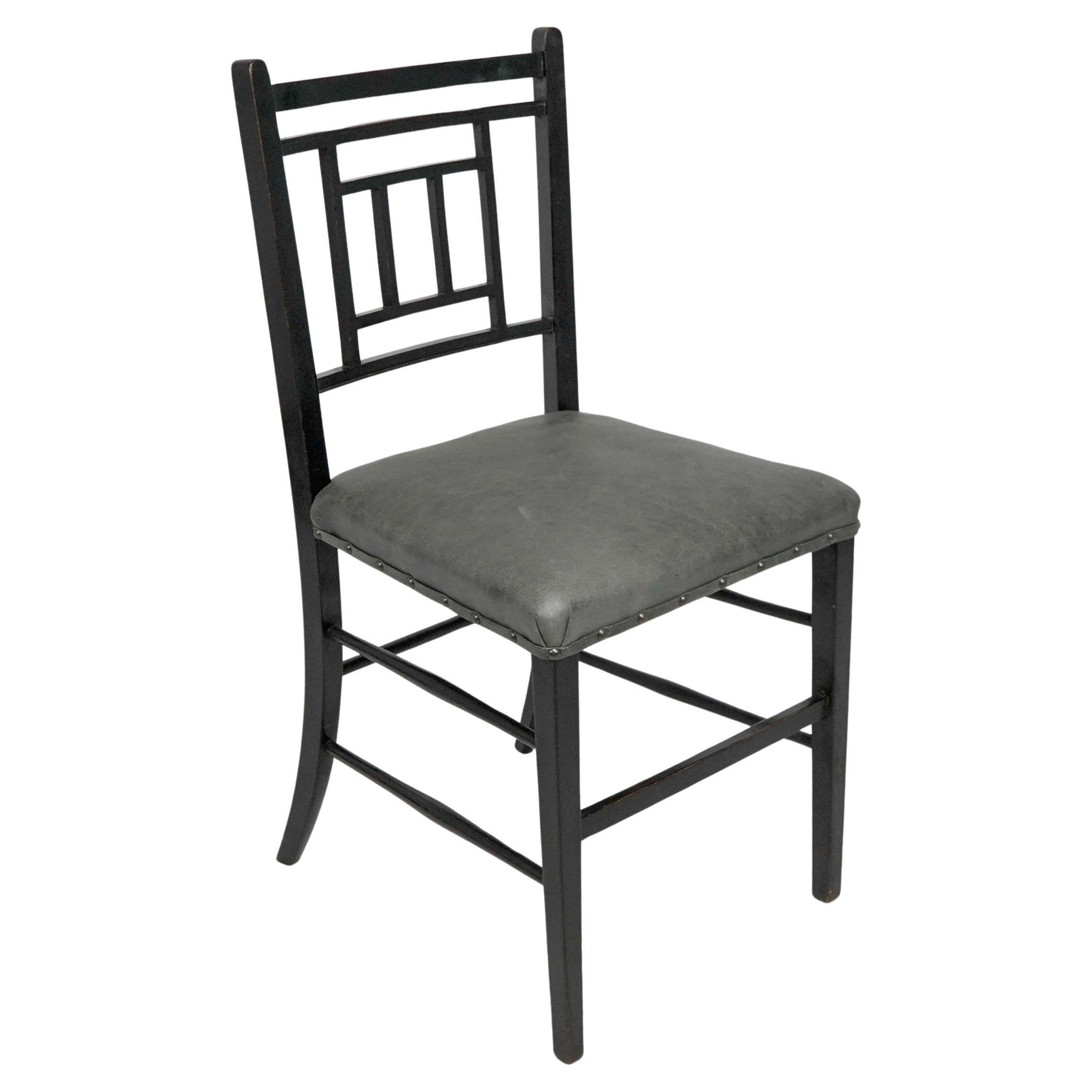 E W Godwin An Anglo-Japanese ebonized side chair professionally upholstered