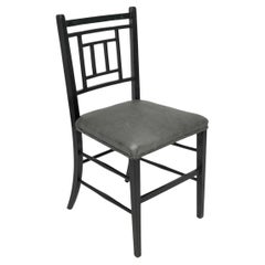 Antique E W Godwin An Anglo-Japanese ebonized side chair professionally upholstered