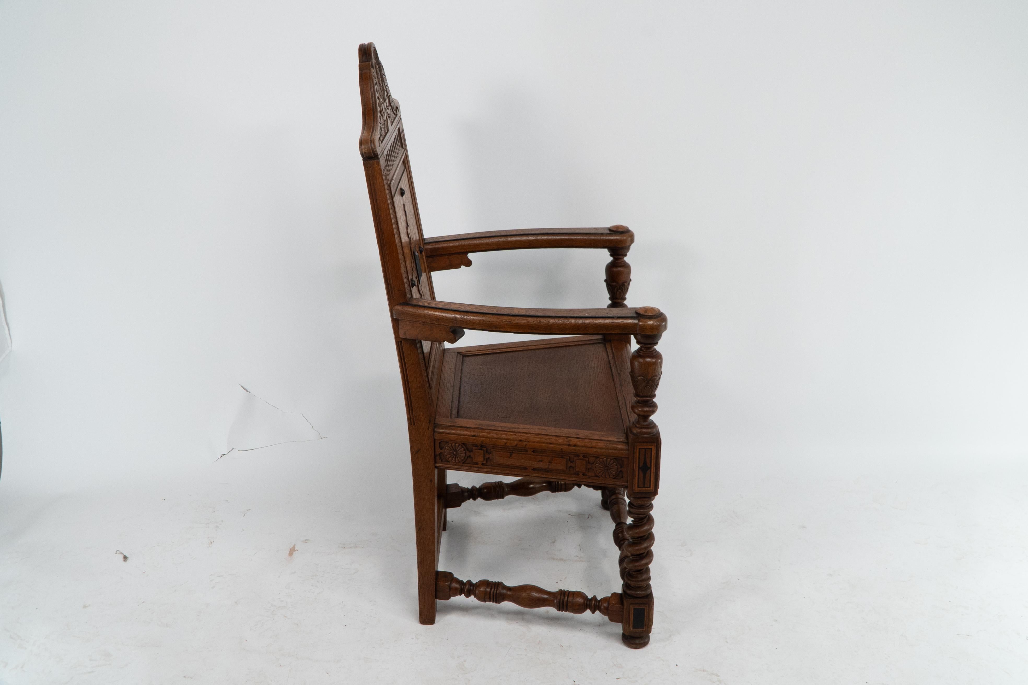 E.W. Godwin attributed, probably made by William Watt. 
An Aesthetic Movement Shakespeare armchair with marquetry and carved decoration. The overall form of this Shakespeare armchair conforms with the drawing and armchair designed by Godwin and made