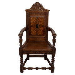 Antique E W Godwin. An Aesthetic Movement Shakespeare armchair with marquetry decoration