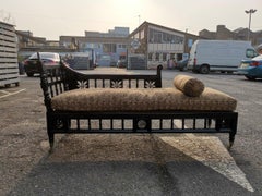 In the Style of E W Godwin, An Anglo-Japanese  Ebonized Chaise Lounge or Day Bed