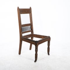 E W Godwin attr. A pair of Aesthetic Movement oak dining chairs ready upholstery