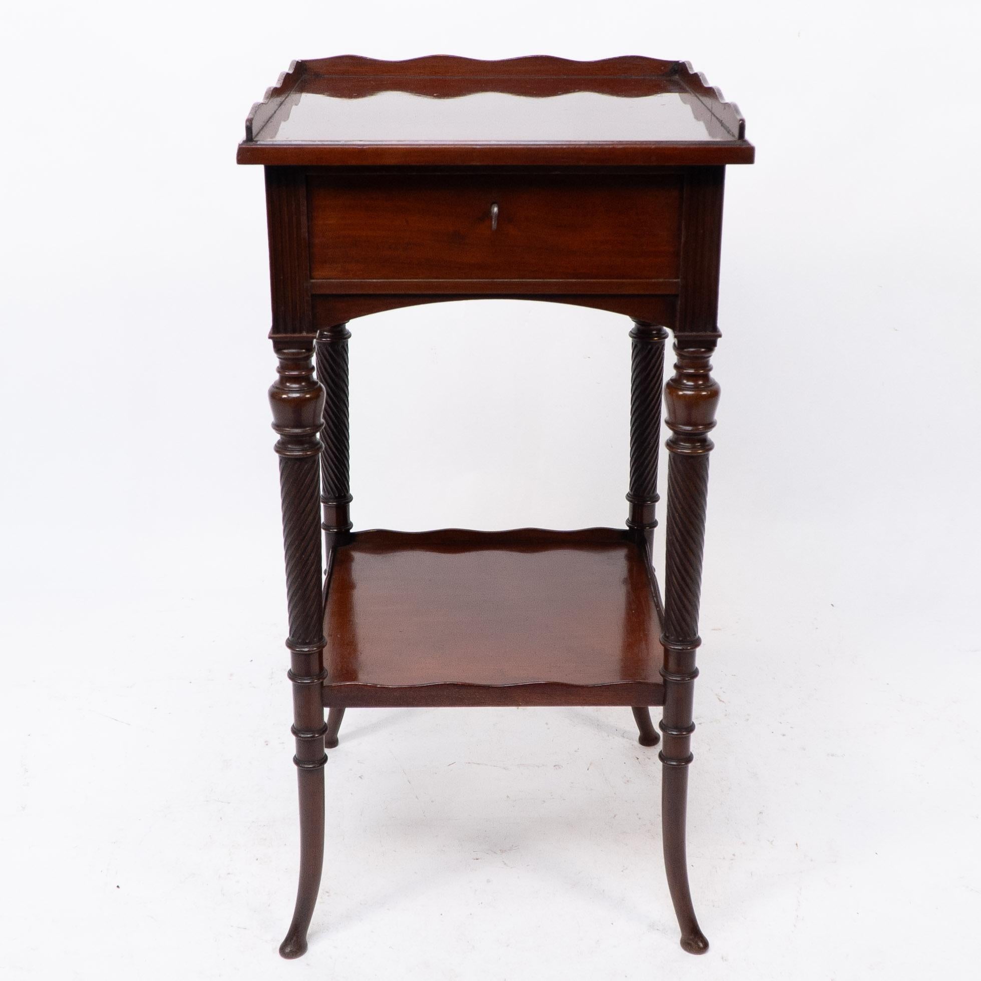 E W Godwin, attributed, made by Collinson & Lock. An Aesthetic movement mahogany side table with spiral-turned legs on out swept feet.
With the original lock and key to the drawer.
Collinson and Lock of London 'Art Furnishers', founded with the