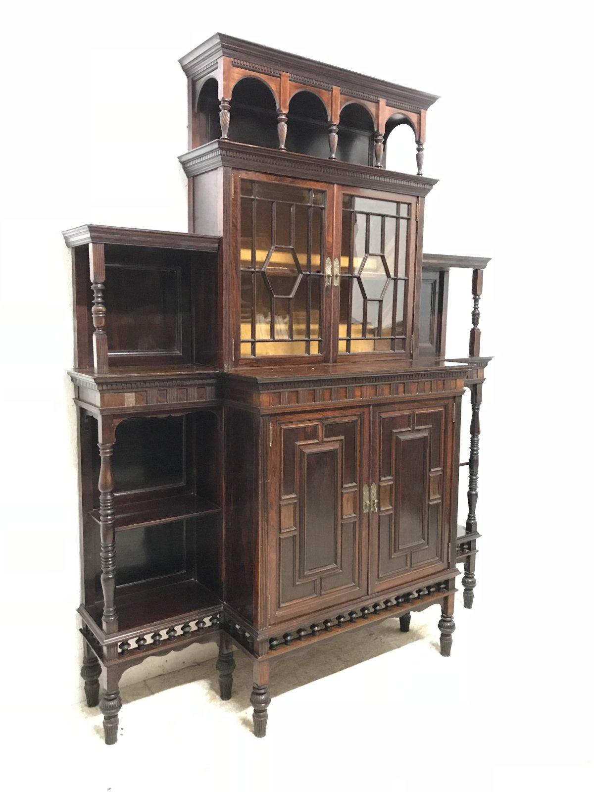 E W Godwin attributed.
A rare and beautiful Anglo-Japanese or aesthetic movement rosewood cabinet made by Collinson and Lock of London, with finely detailed brass drop scroll work handles and Anglo-Japanese incised basket weave detailed back