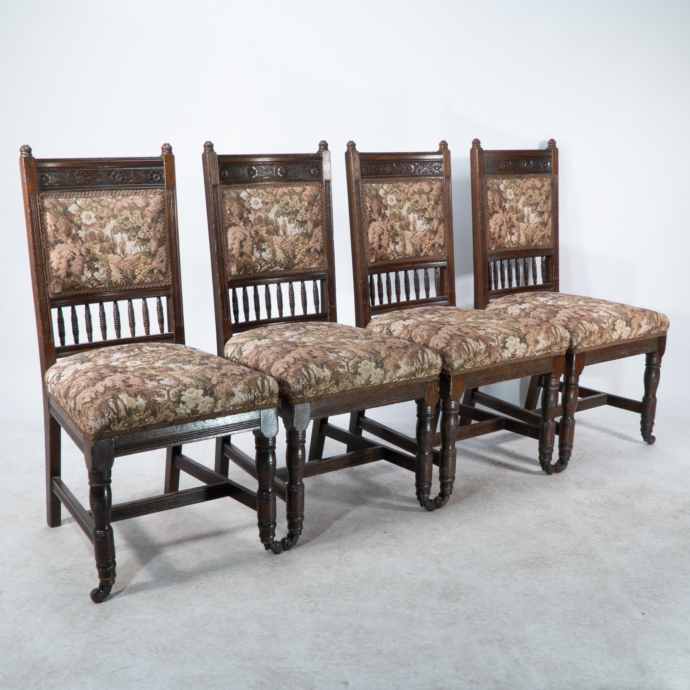 Edward William Godwin attributed. 
A set of four Aesthetic Movement oak dining chairs with carved florets to the headrests and a turned gallery below the backrest with finely turned legs.
See Soros, Susan Weber 'The Secular Furniture of E.W.