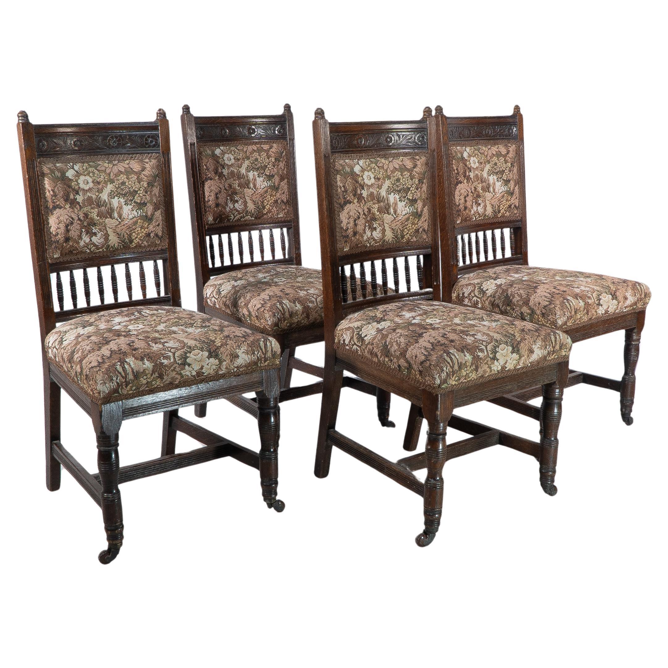 E W Godwin attributed, A set of four Aesthetic Movement oak dining chairs