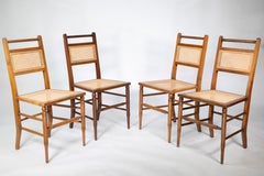 E W Godwin (attributed). A set of four Anglo-Japanese cane seat chairs