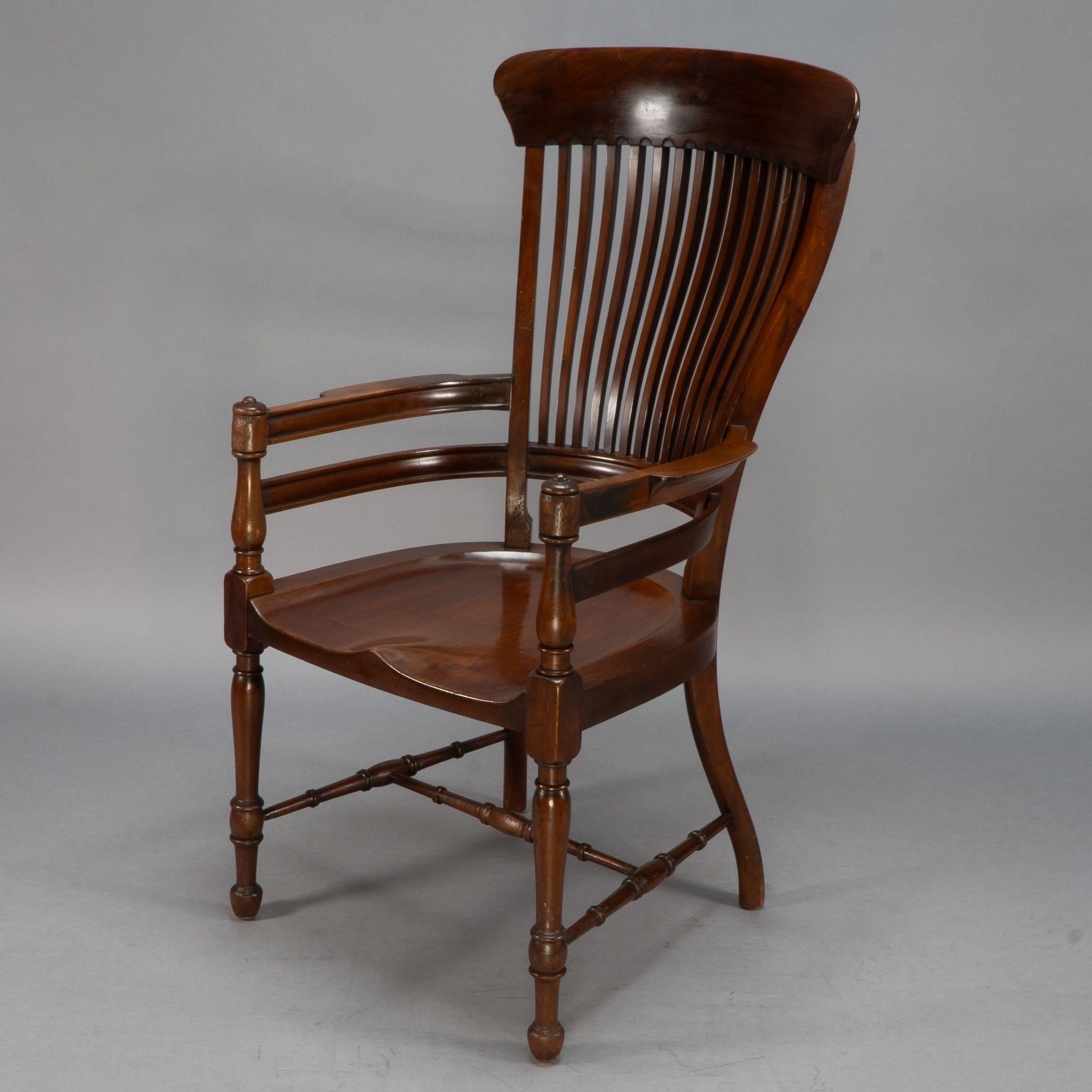 Aesthetic Movement E. W. Godwin, Attributed. A tall back serpentine shape Walnut Armchair For Sale