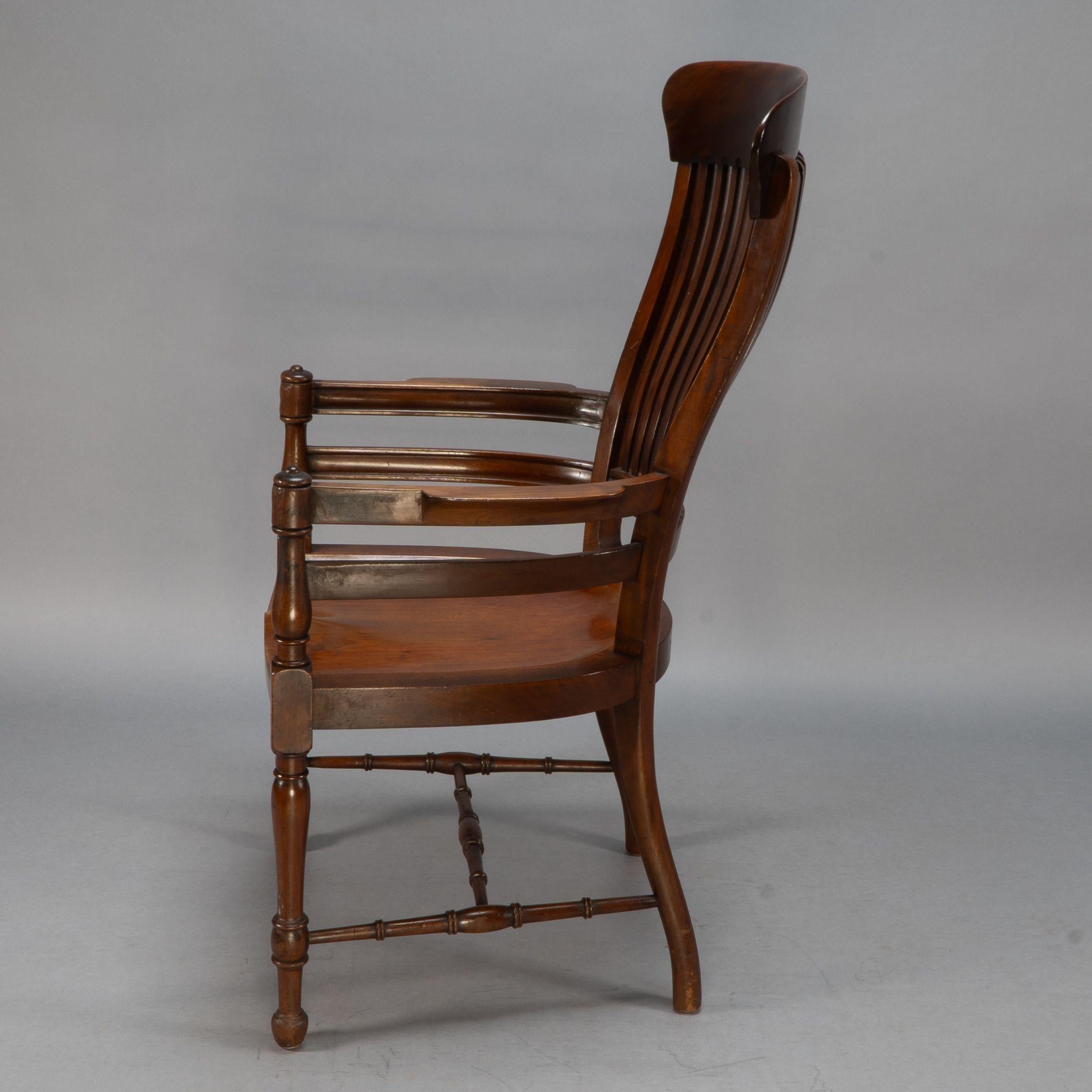 E. W. Godwin, Attributed. A tall back serpentine shape Walnut Armchair In Good Condition For Sale In London, GB