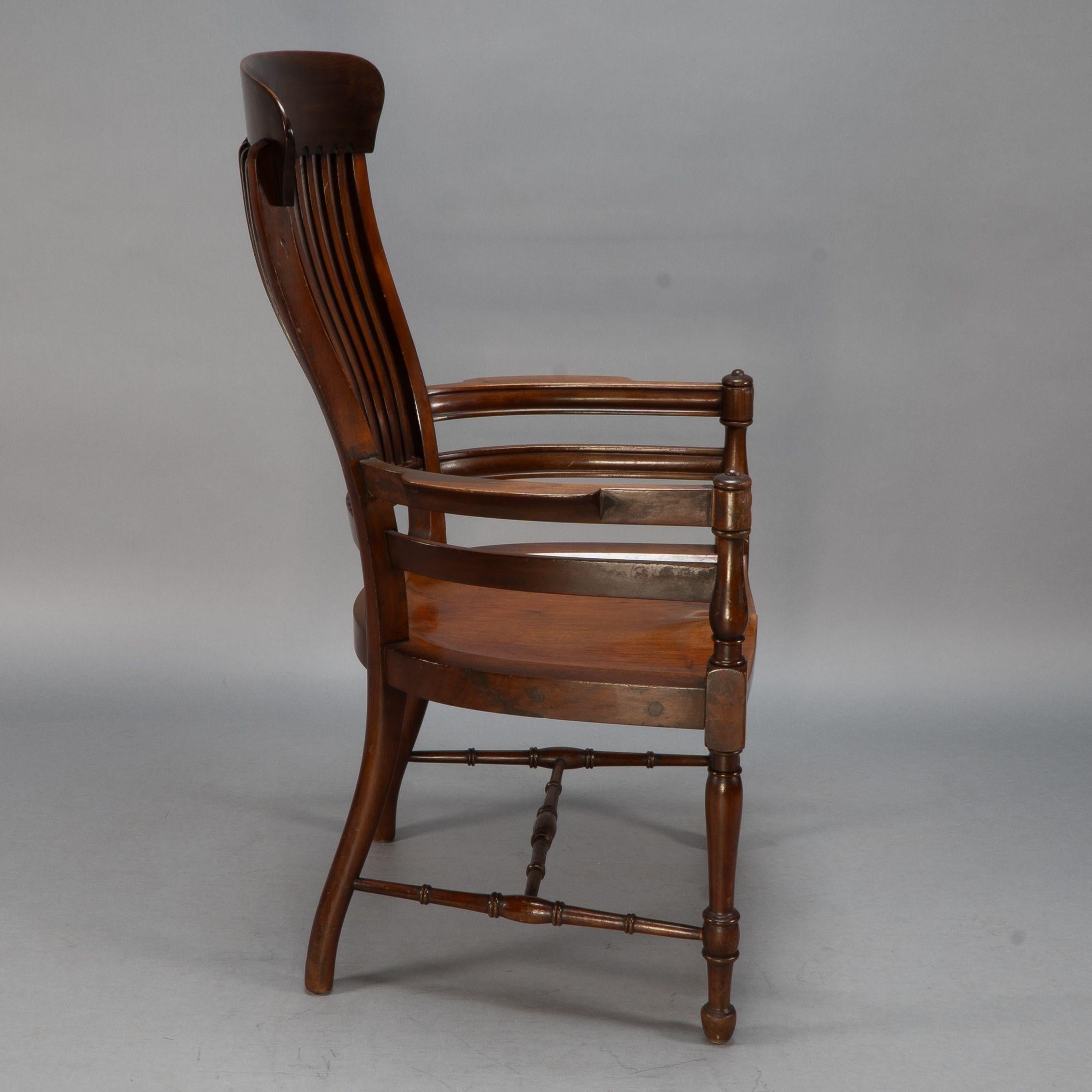 Late 19th Century E. W. Godwin, Attributed. A tall back serpentine shape Walnut Armchair For Sale