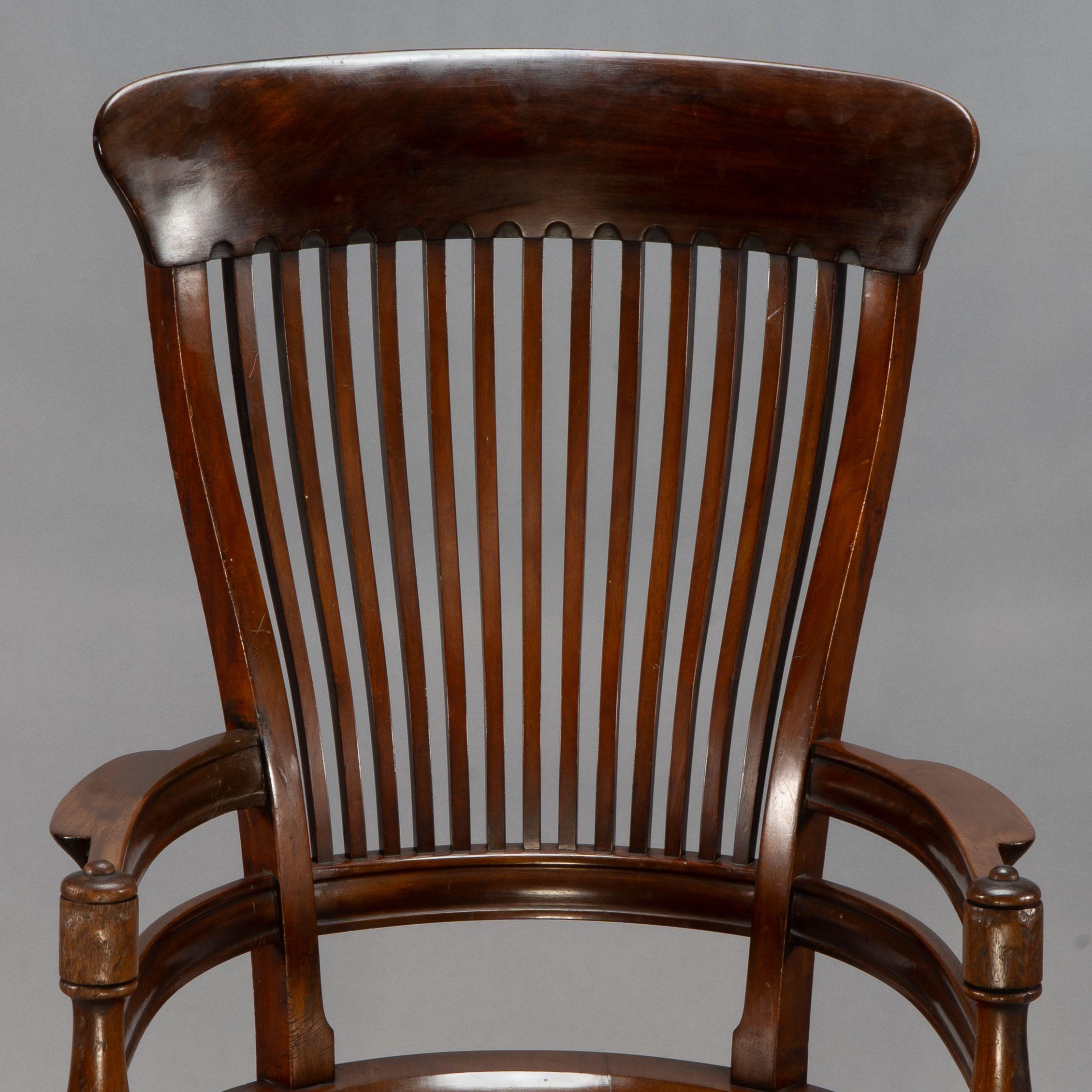 E. W. Godwin, Attributed. A tall back serpentine shape Walnut Armchair For Sale 1