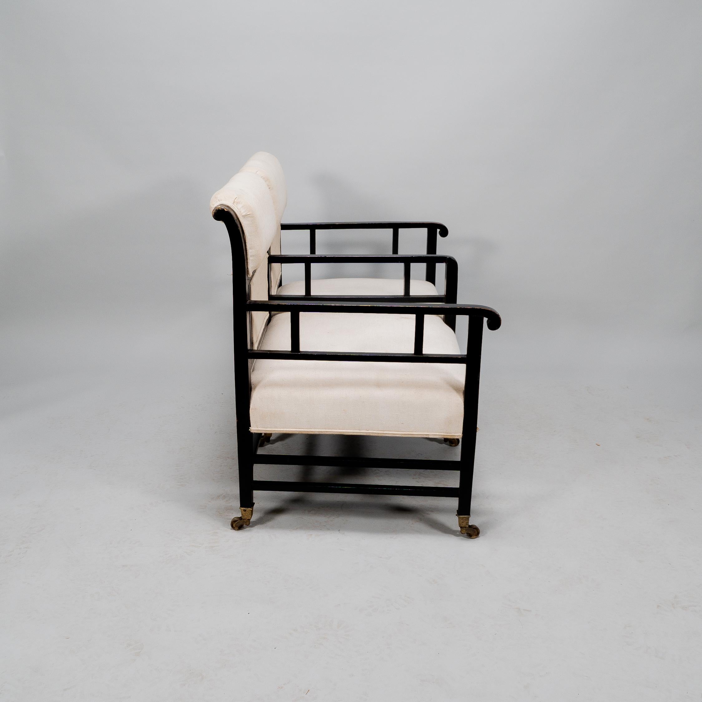 E W Godwin (attributed). An Anglo-Japanese ebonized duet or conversation settee. For Sale 1