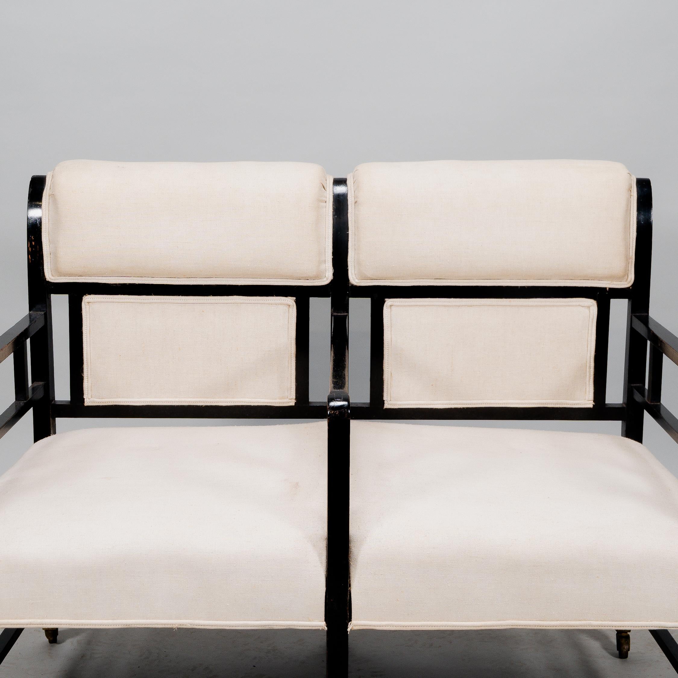 E W Godwin (attributed). An Anglo-Japanese ebonized duet or conversation settee. For Sale 2