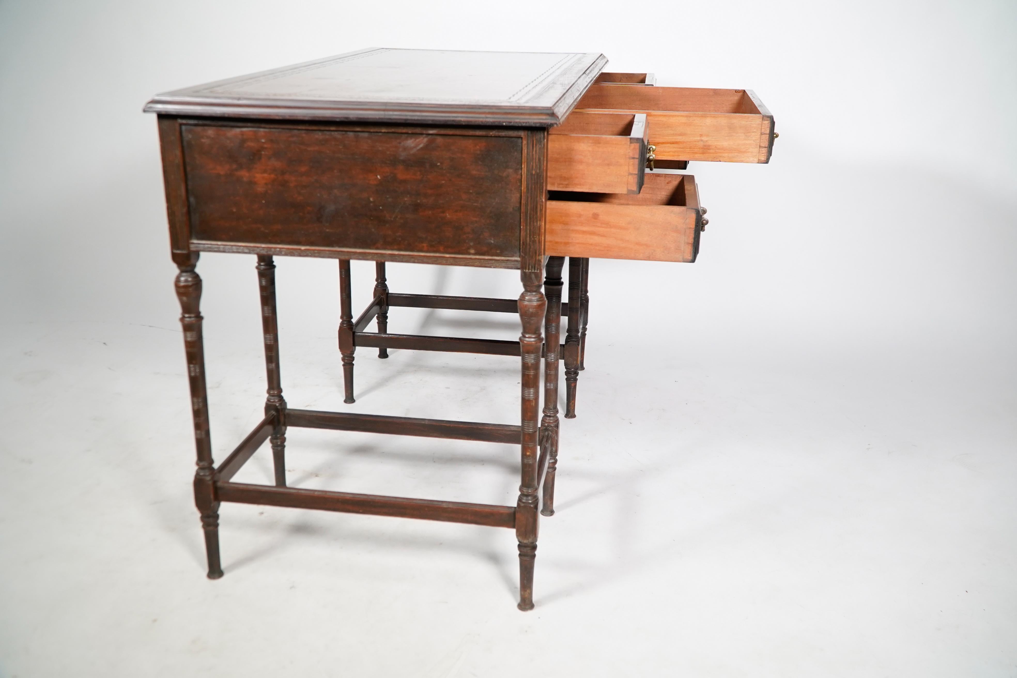E W Godwin attr for Collinson & Lock. An Aesthetic Movement walnut writing table For Sale 1