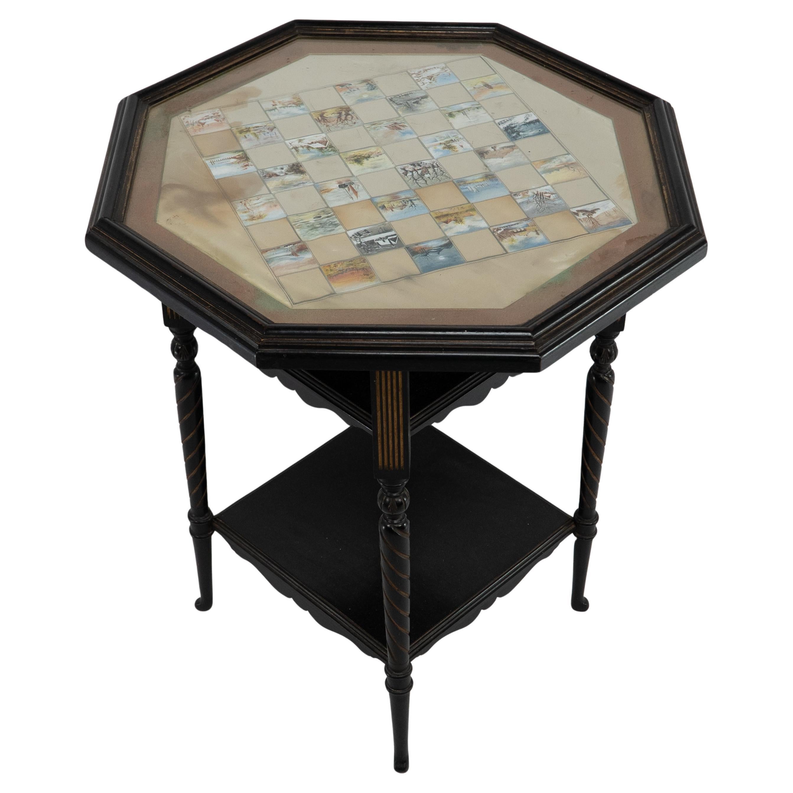 E W Godwin for Collinson & Lock An ebonised & parcel gilt side table chess table For Sale