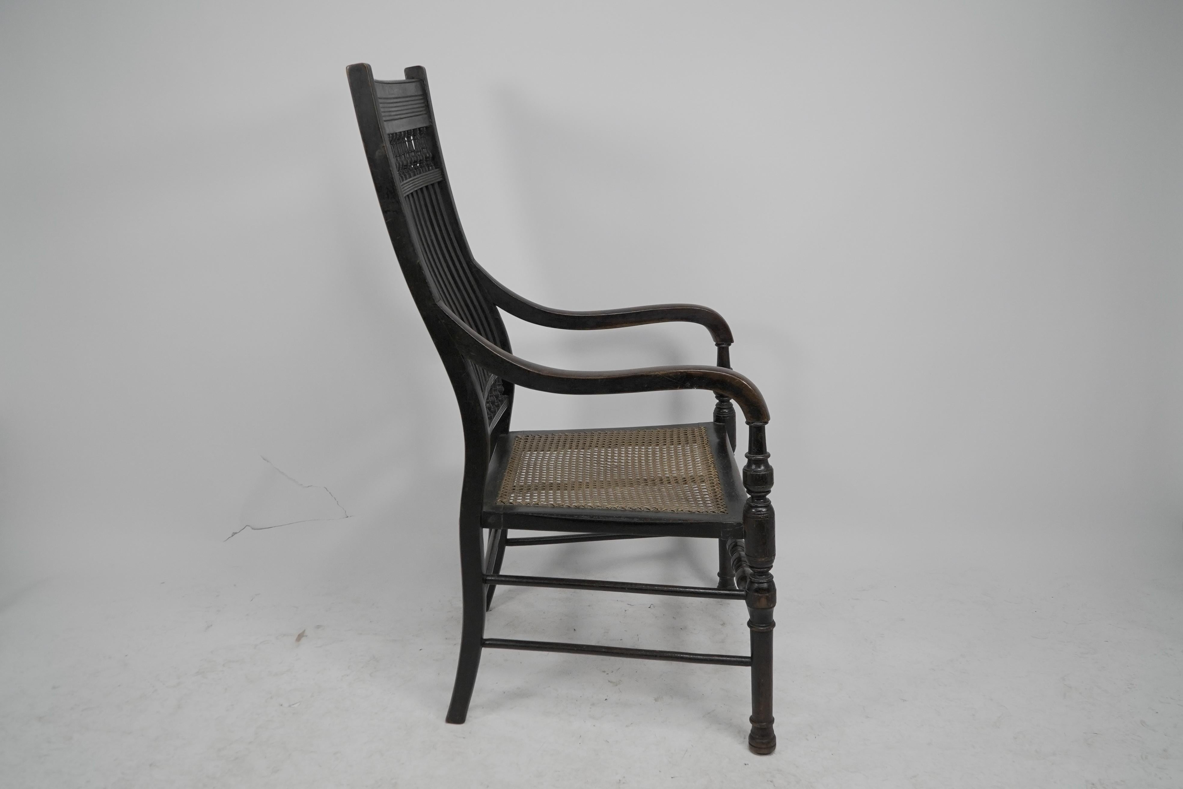 English E W Godwin for William Watt An Aesthetic Movement tall back ebonized armchair. For Sale