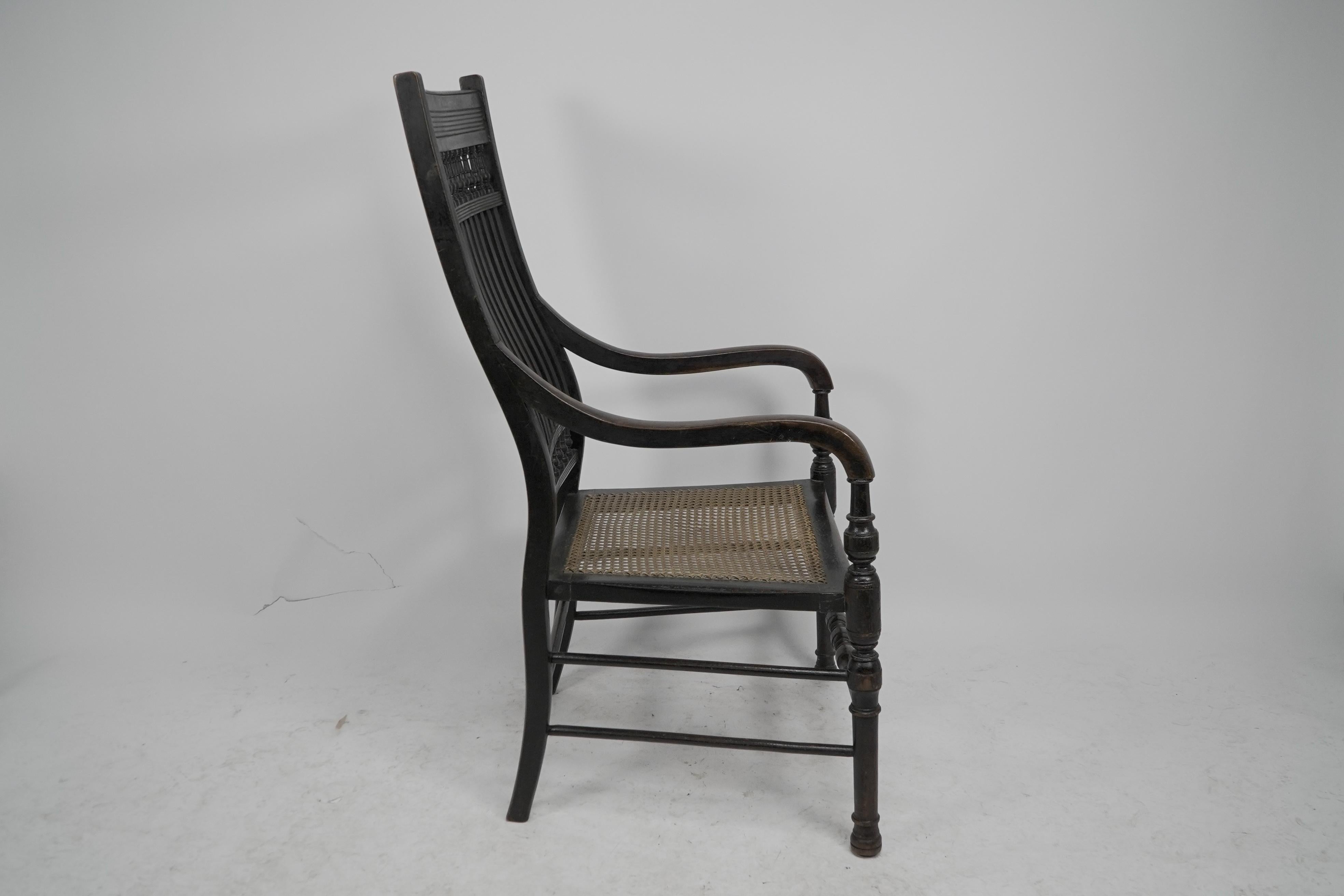 E W Godwin para William Watt Un sillón ebonizado de respaldo alto del Aesthetic Movement. Movimiento estético en venta