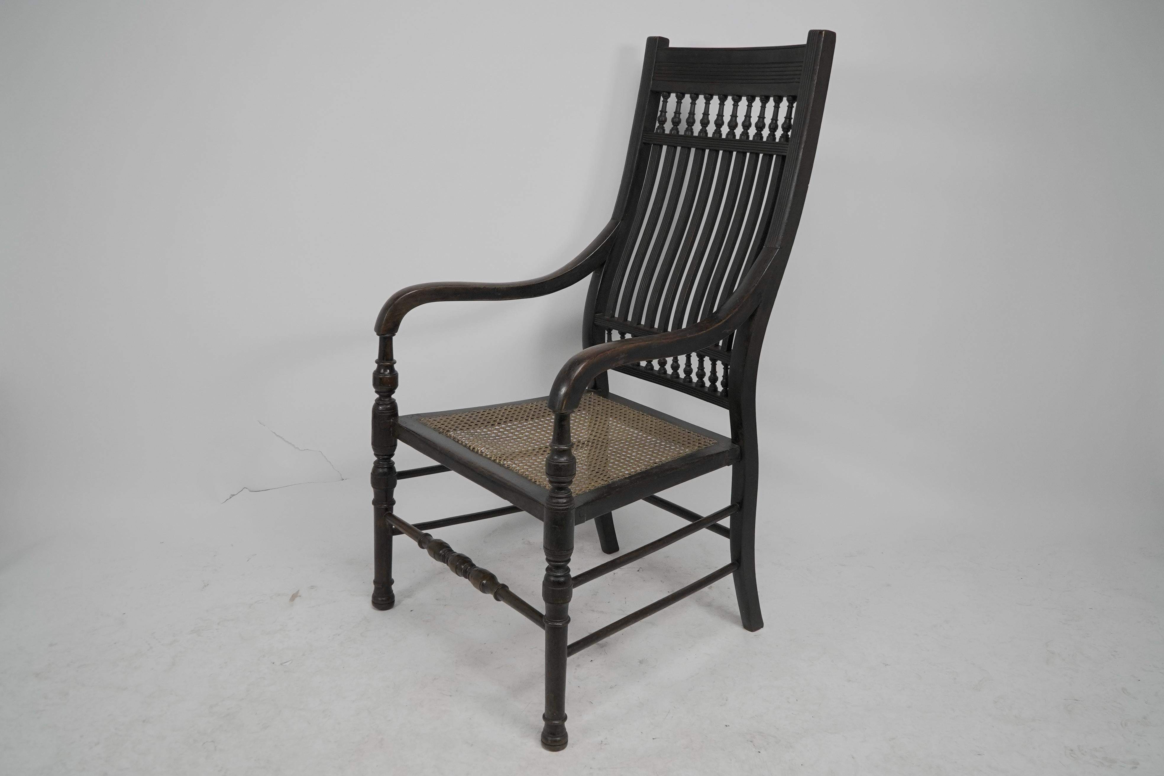 E W Godwin for William Watt An Aesthetic Movement tall back ebonized armchair. In Good Condition For Sale In London, GB