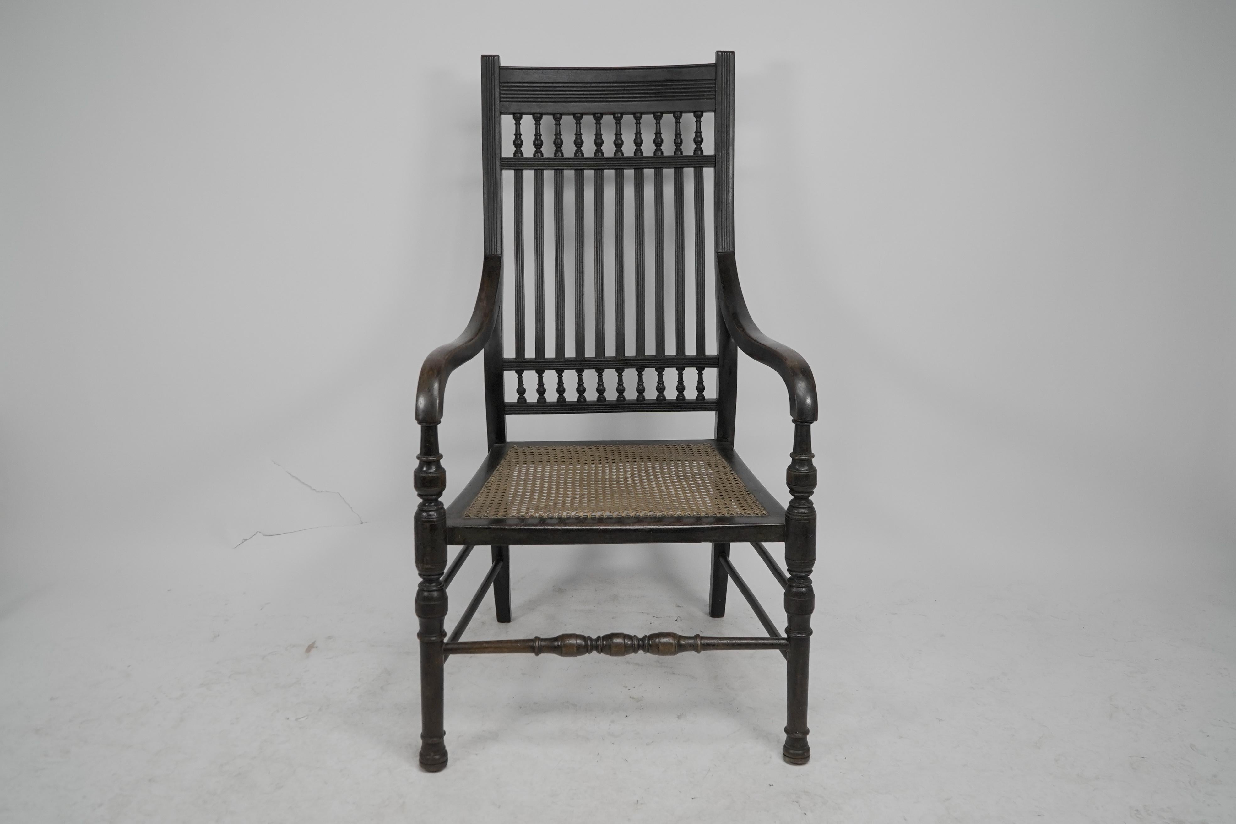 Late 19th Century E W Godwin for William Watt An Aesthetic Movement tall back ebonized armchair. For Sale
