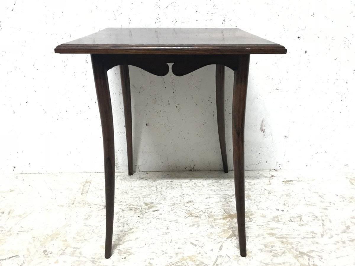 E W Godwin manner, Collinson and Lock, attributed maker.
A petite Anglo-Japanese rosewood side table with a beautiful figured top, below with shaped apron and central cut-out decoration.
Collinson and Lock of London 'Art Furnishers', founded with