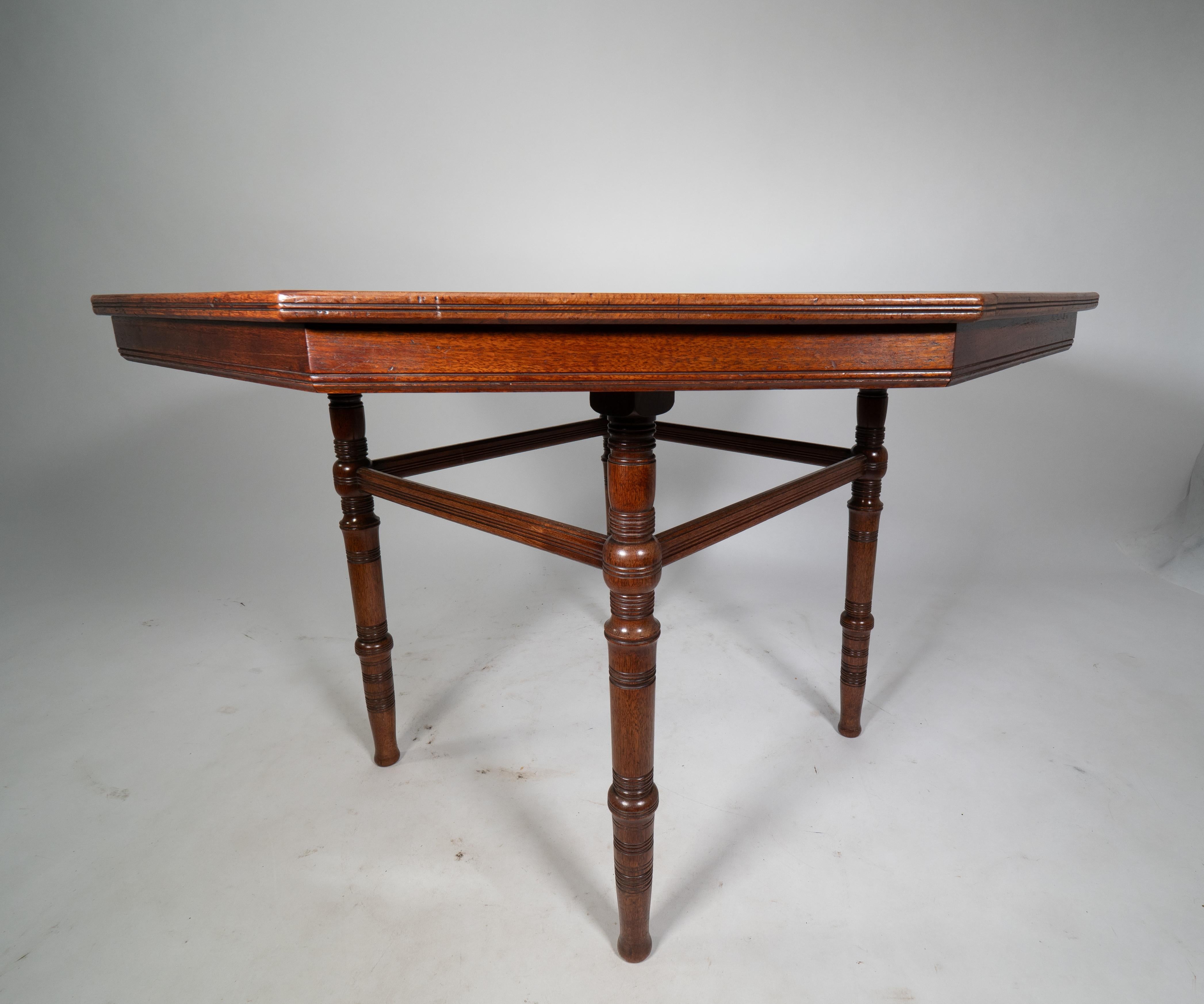 E W Godwin attributed. An Aesthetic Movement Walnut octagonal centre table For Sale 1