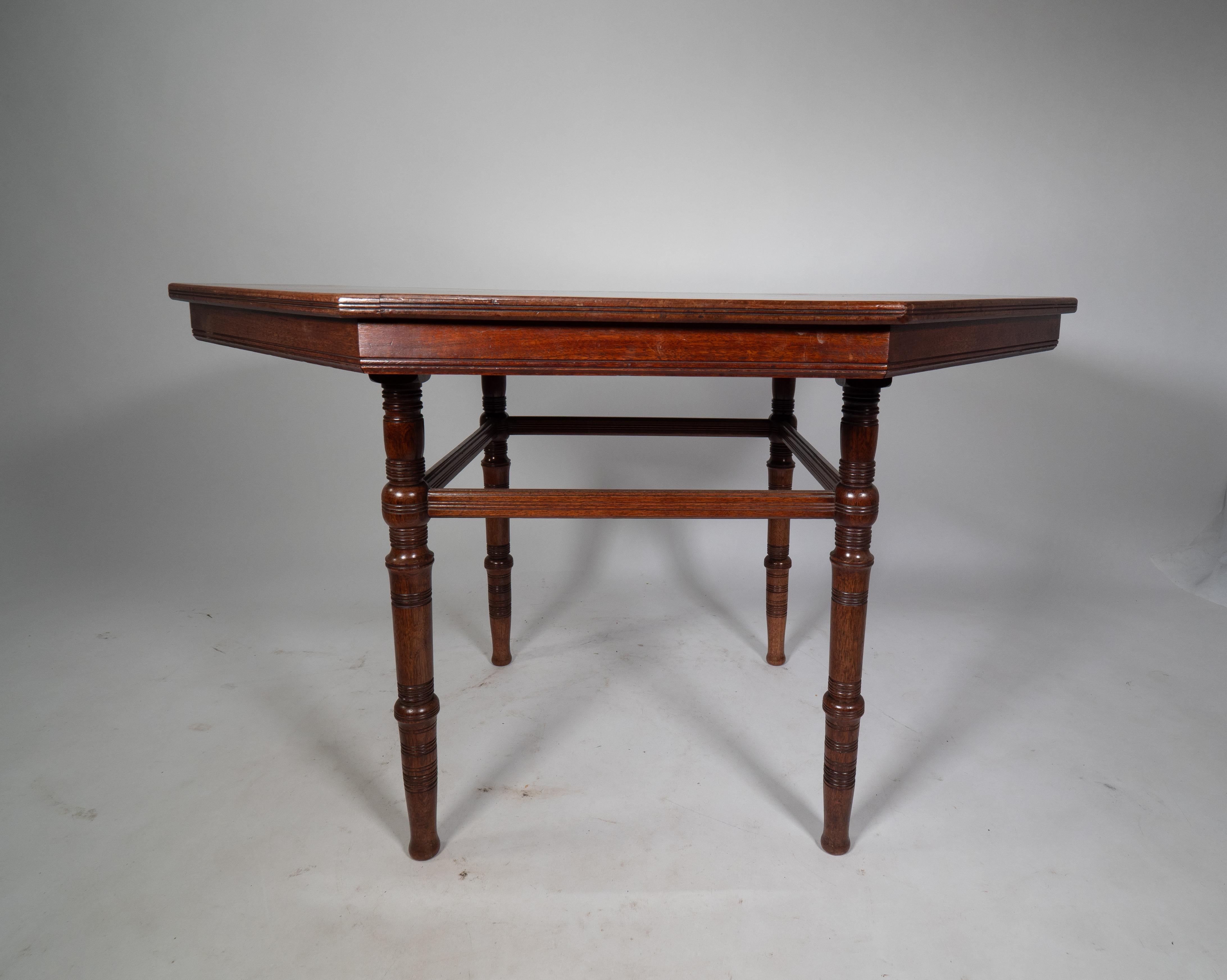 E W Godwin attributed. An Aesthetic Movement Walnut octagonal centre table For Sale 2